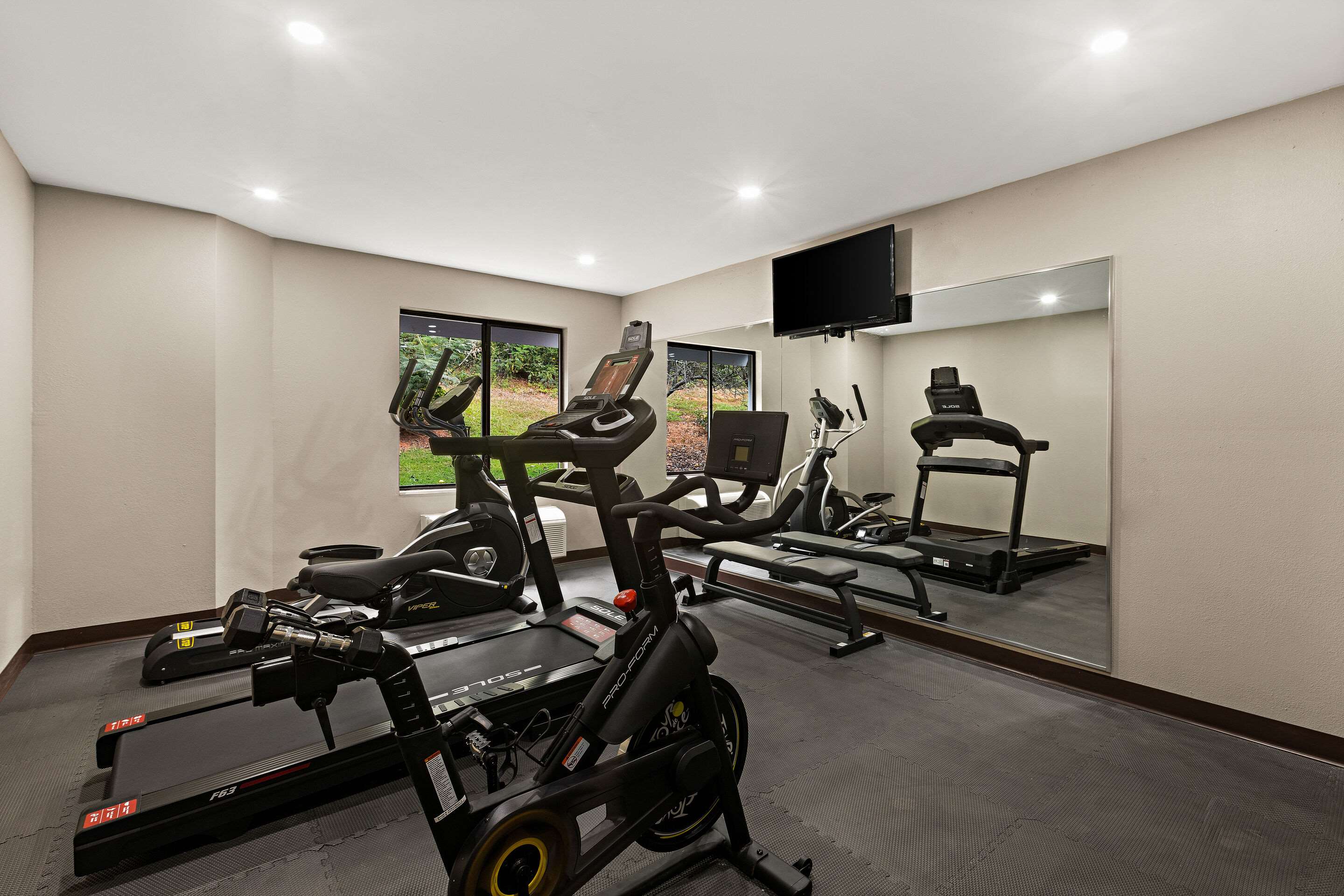 Exercise room with cardio equipment | Sleep Inn