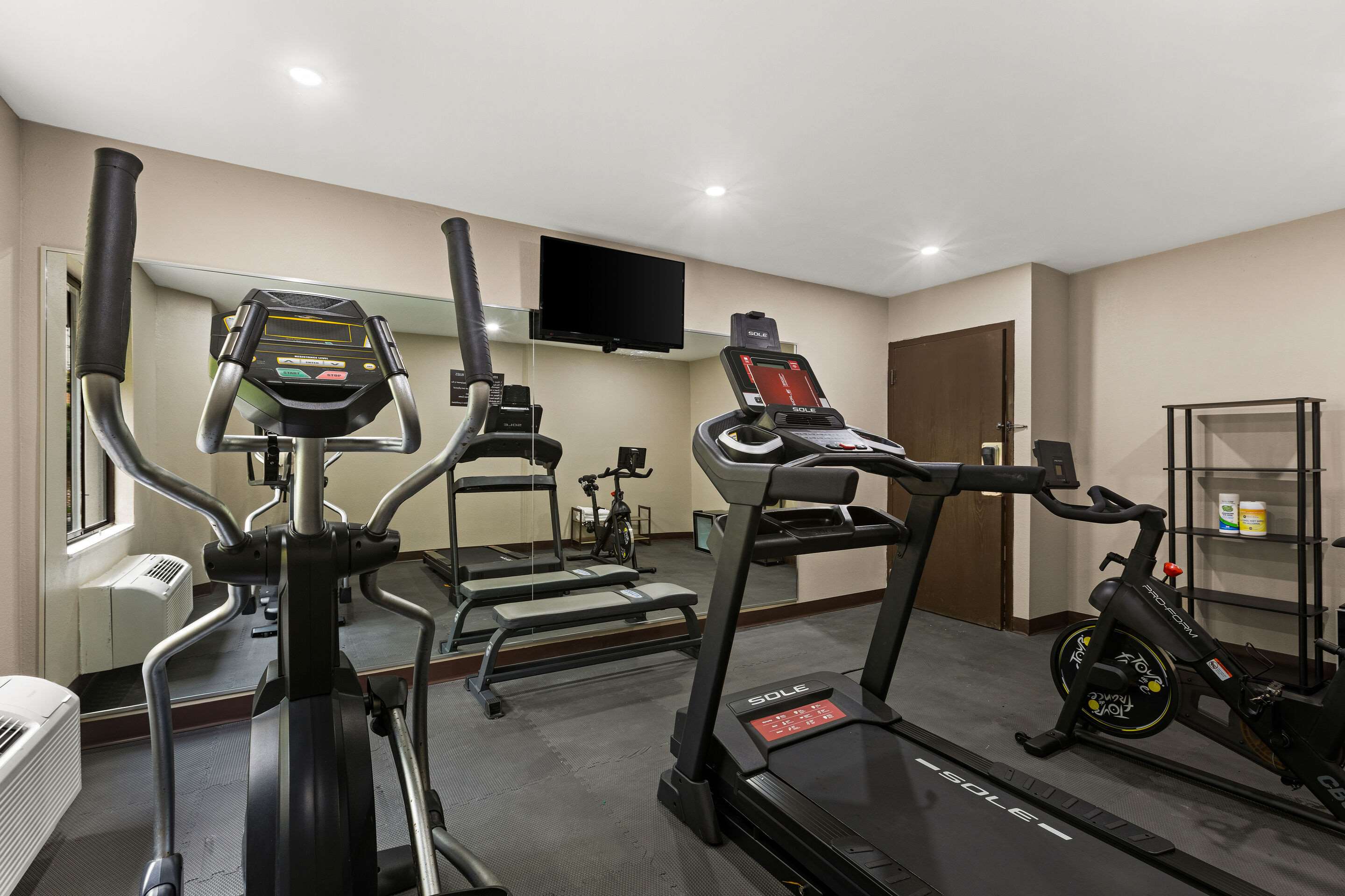 Exercise room with cardio equipment | Sleep Inn
