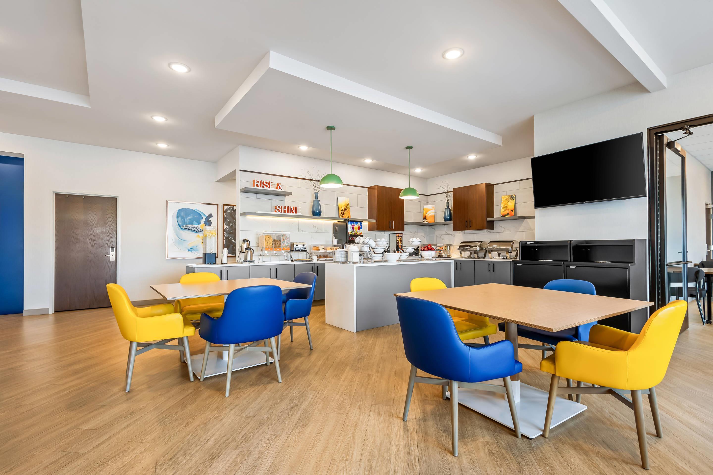 Enjoy breakfast in this seating area | Comfort Inn & Suites at Sanford Sports Complex