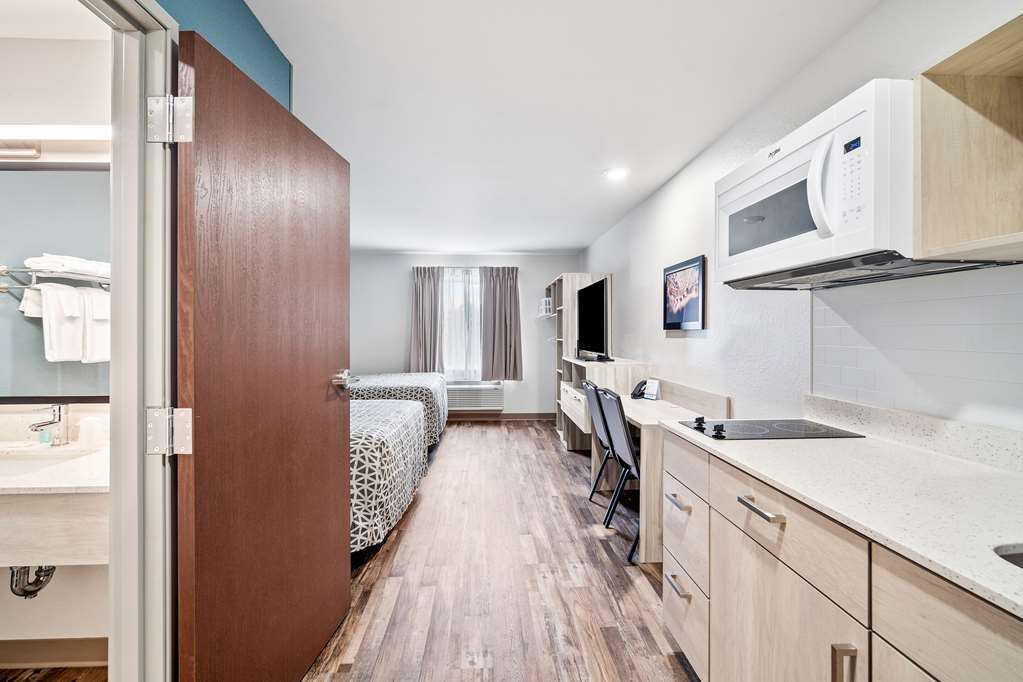 WOODSPRING SUITES FORT MYERS - CAPE-guestroom-Guest Room,On-Site.jpg