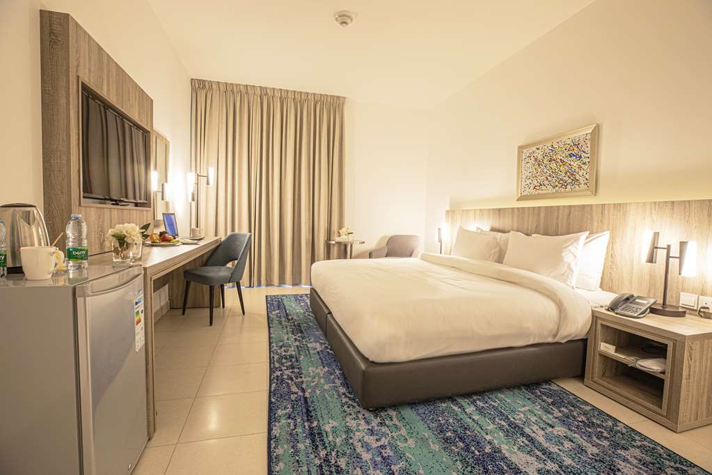 GOLDEN TULIP AMMAN-guestroom-Guest Room,Bed,Guest Room Amenity,Living Area,Honeymoon,On-Site,Guest Room - Whole Room.jpg