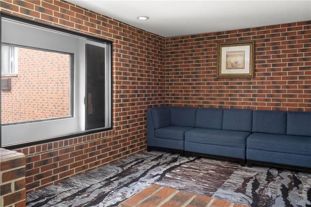 RAMADA BY WYNDHAM CEDAR RAPIDS-guestroom-Sitting area,On-Site.jpg