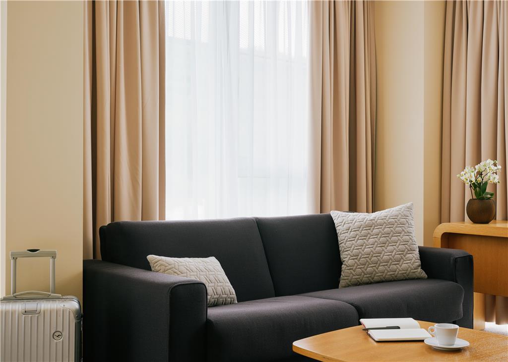 LUFTHANSA SEEHEIM-guestroom-Guest Room,Living Area,Architecture,Indoor/Interior,On-Site,Décor detail,Summer,View from room,Exterior View of Building,Drink.jpg