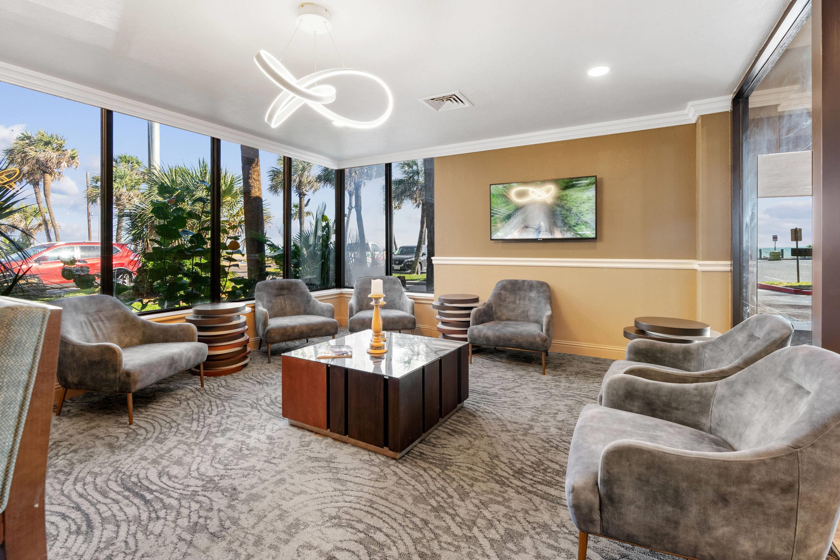 Spacious lobby with sitting area | Beachfront Palms Hotel Galveston