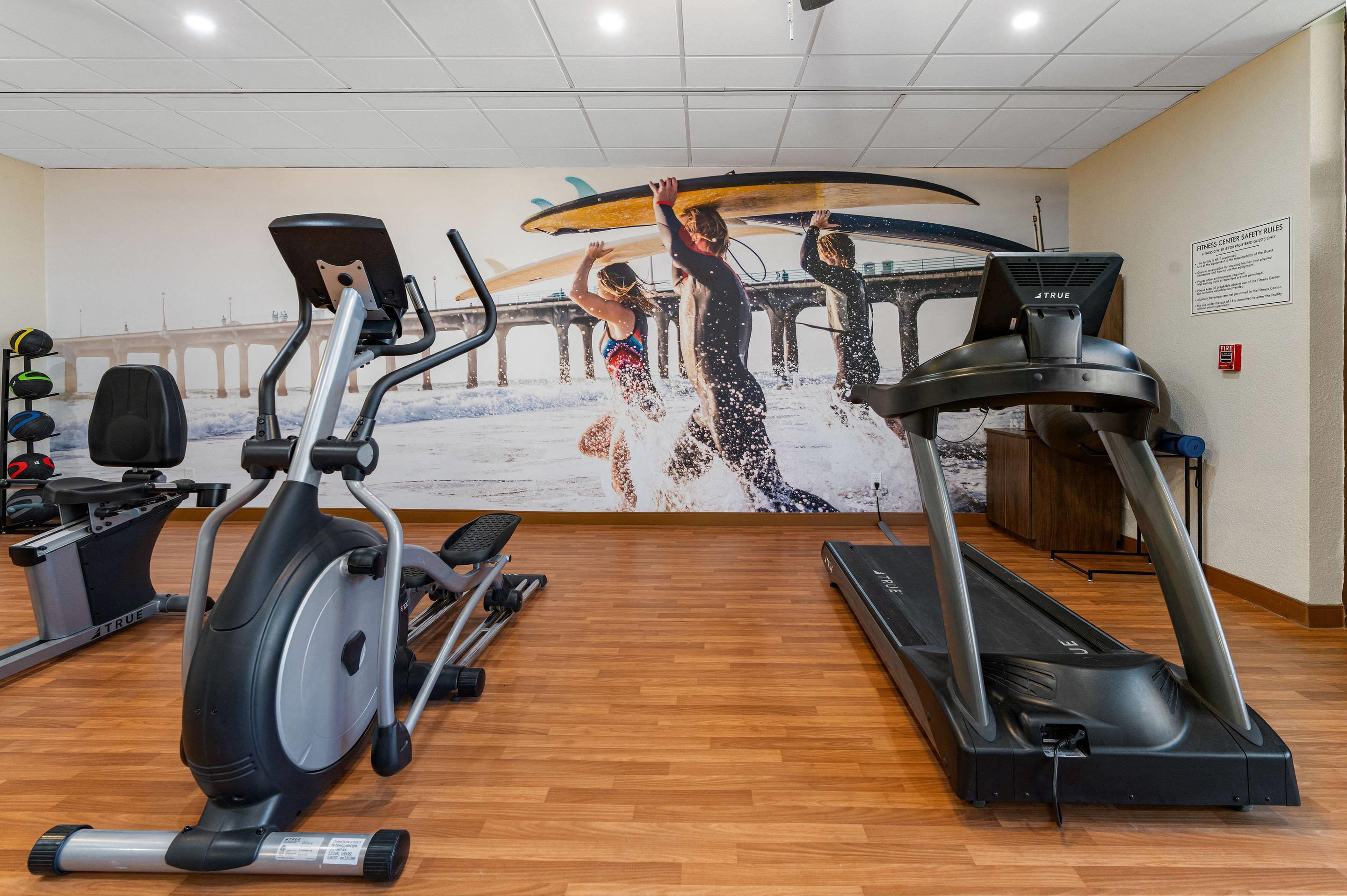 Exercise room with cardio equipment | Beachfront Palms Hotel Galveston