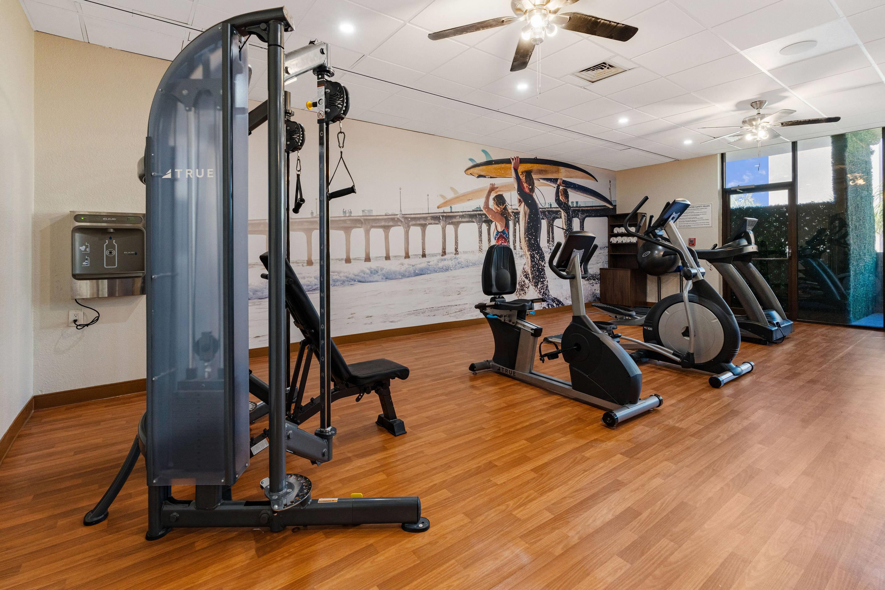 Exercise room with cardio equipment | Beachfront Palms Hotel Galveston