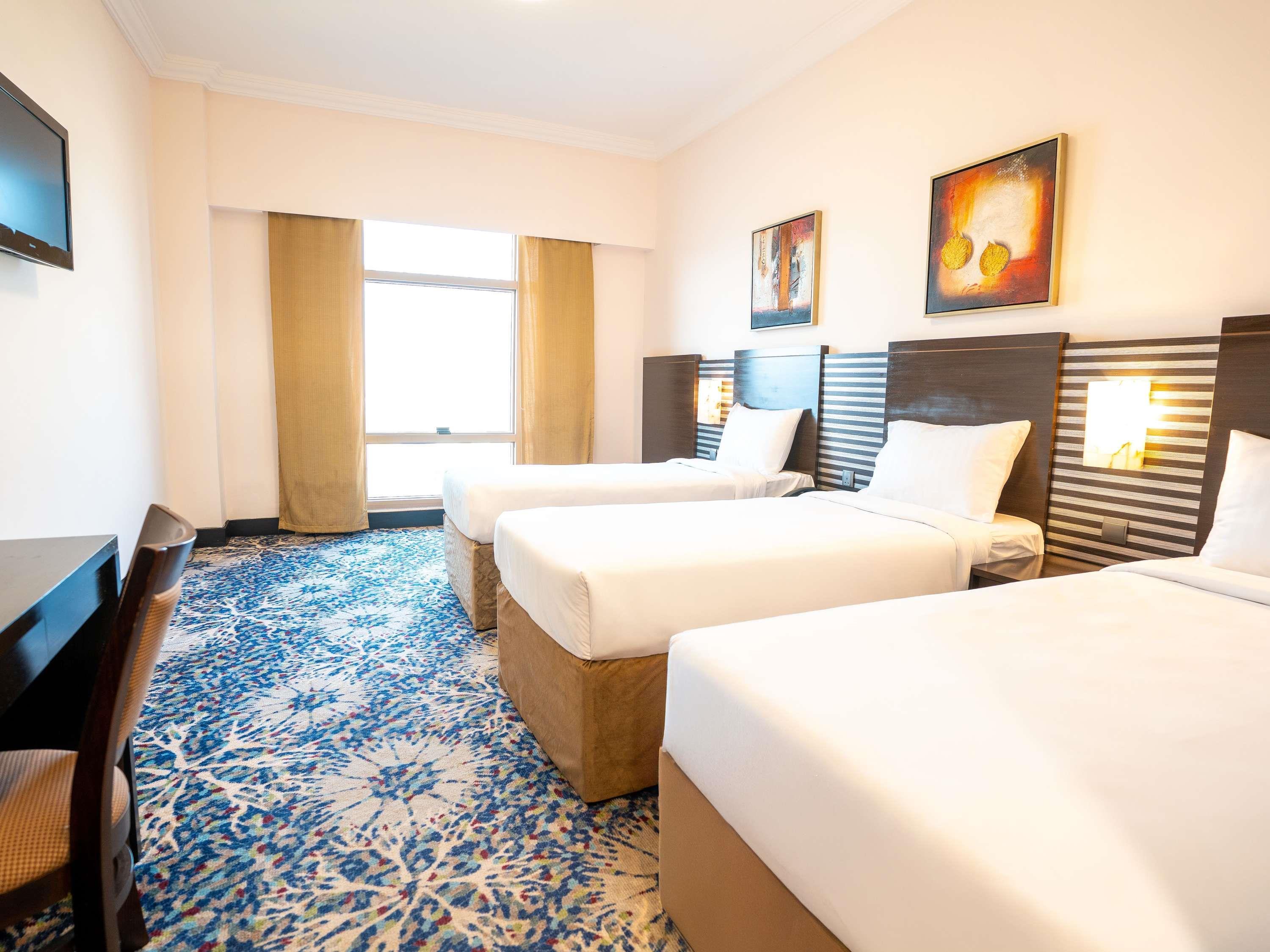 Al Hidayah Towers & Hotel Room Type - Deluxe Triple Room with Three Single Beds Al Hidayah Towers & Hotel Room Type - Deluxe Triple Room with Three Single Beds