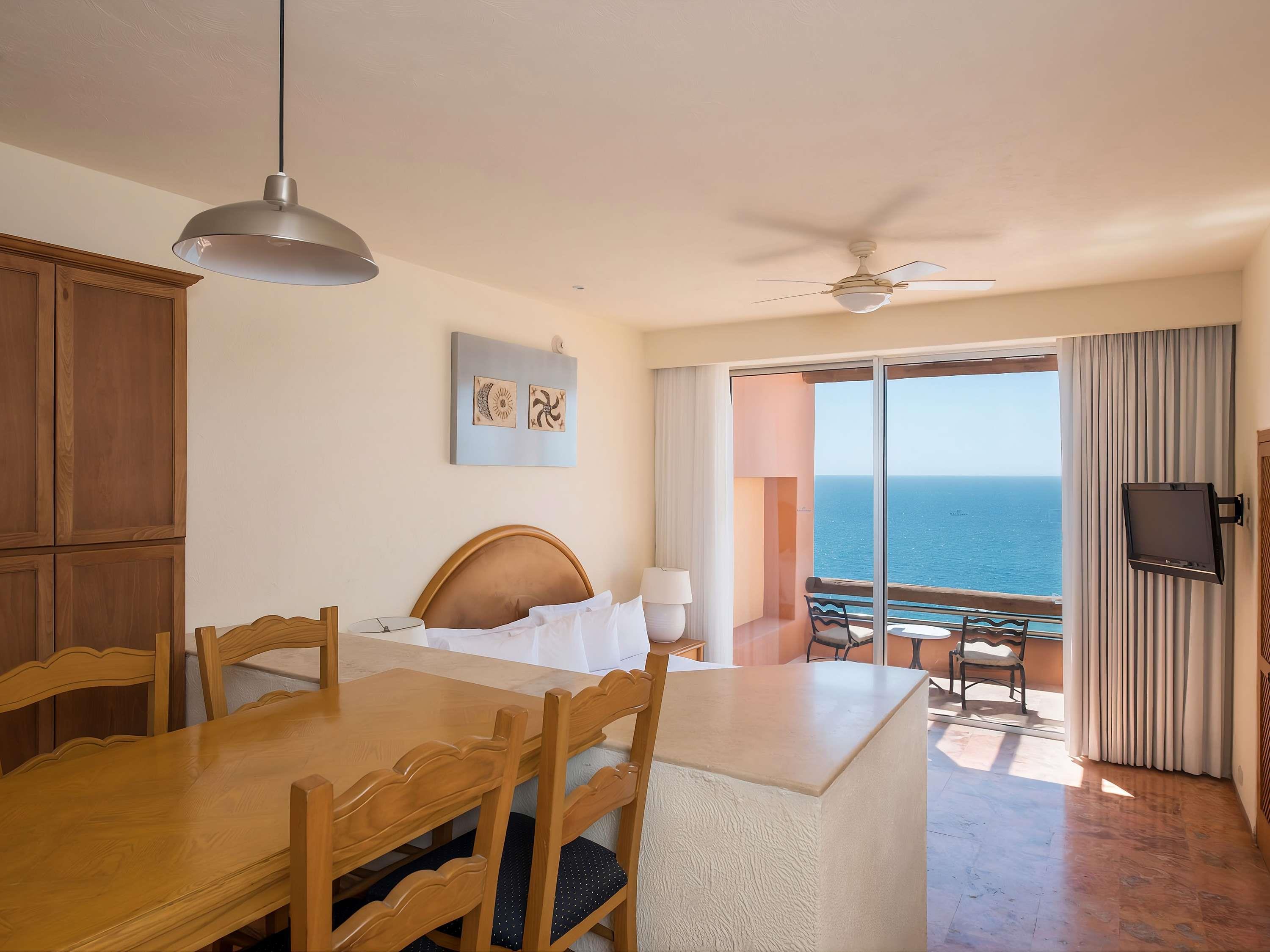 Club Regina Los Cabos Room Type - Studio Room, one king-size bed, full kitchen, dining area, terrace, ocean view