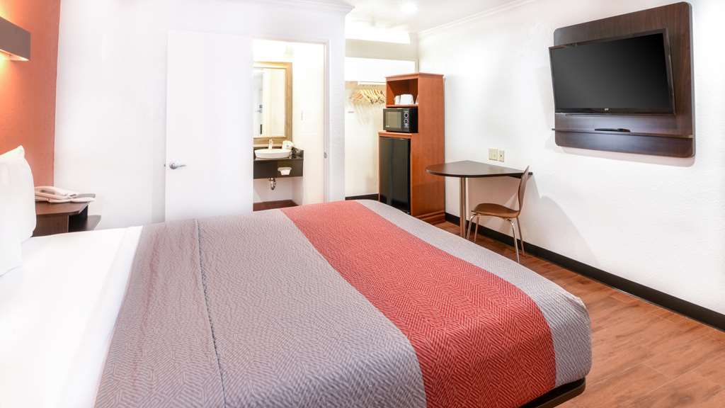 MOTEL 6 ONTARIO-guestroom-Guest Room,Bathroom,Sink,Bed,Bedding,Guest Room Amenity,Mini-Refrigerator,TV and multimedia,Sitting area,Indoor/Interior,On-Site,Furnishings,Single Room.jpg