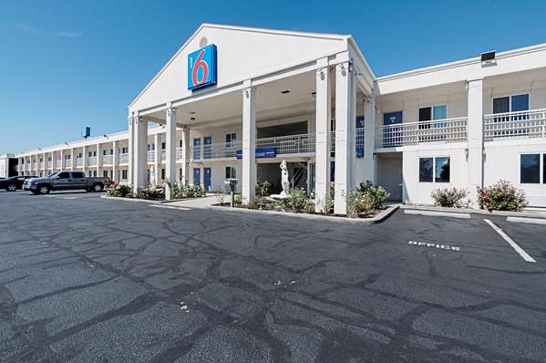 Property logo or sign,On-Site,Outdoor/Exterior,Property Amenity,Entrance,Parking,Day,Exterior View of Building