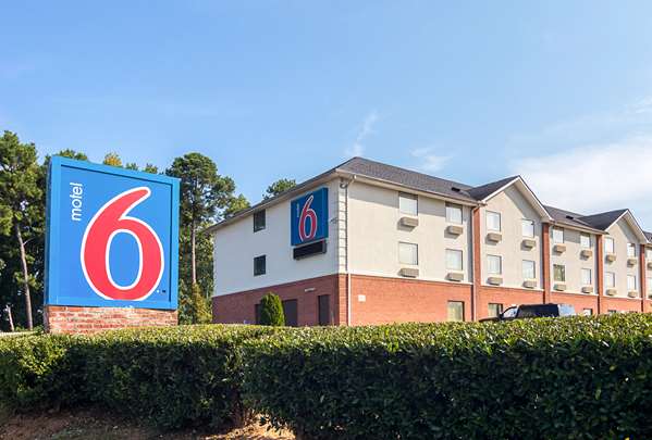 Property logo or sign,On-Site,Outdoor/Exterior,Property Amenity,Parking,Day,Exterior View of Building