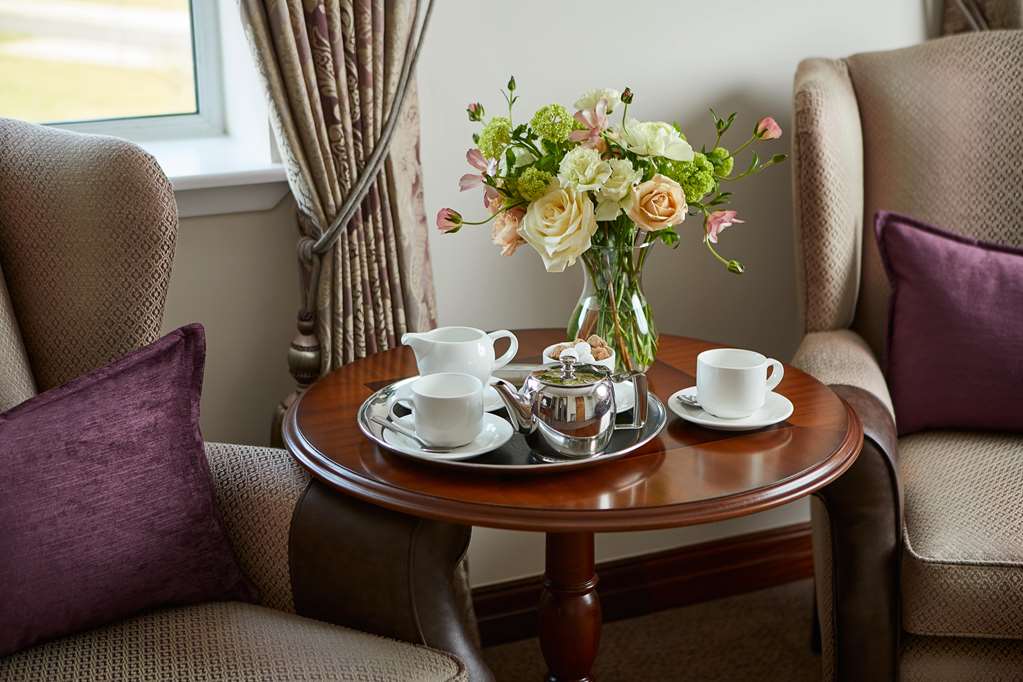 Macdonald Berystede-guestroom-Guest Room,Guest Room Amenity,Coffee/tea facilities,Living Area,Architecture,Indoor/Interior,On-Site,Décor detail,View from room,Exterior View of Building,Drink.jpg