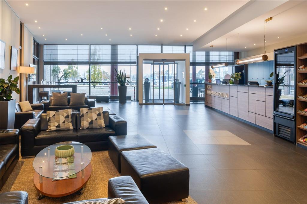 WOLFSBURG CENTRUM AFFILIATED BY MHI-guestroom-Guest Room,Living Area,Architecture,Indoor/Interior,On-Site,Décor detail,Summer,View from room,Exterior View of Building.jpg