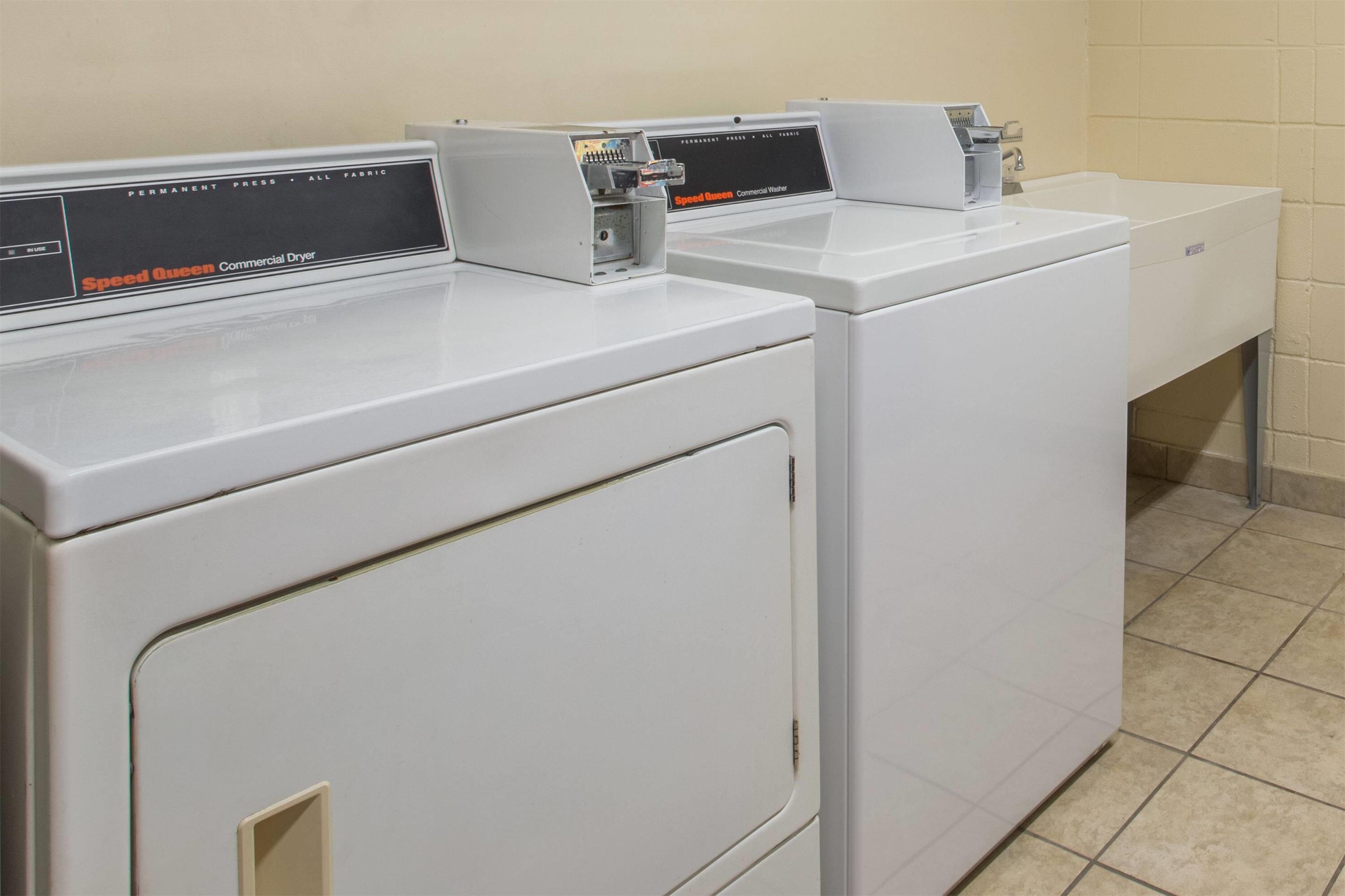 Laundry | Days Inn & Suites by Wyndham Navarre - near Beaches/Hurlburt