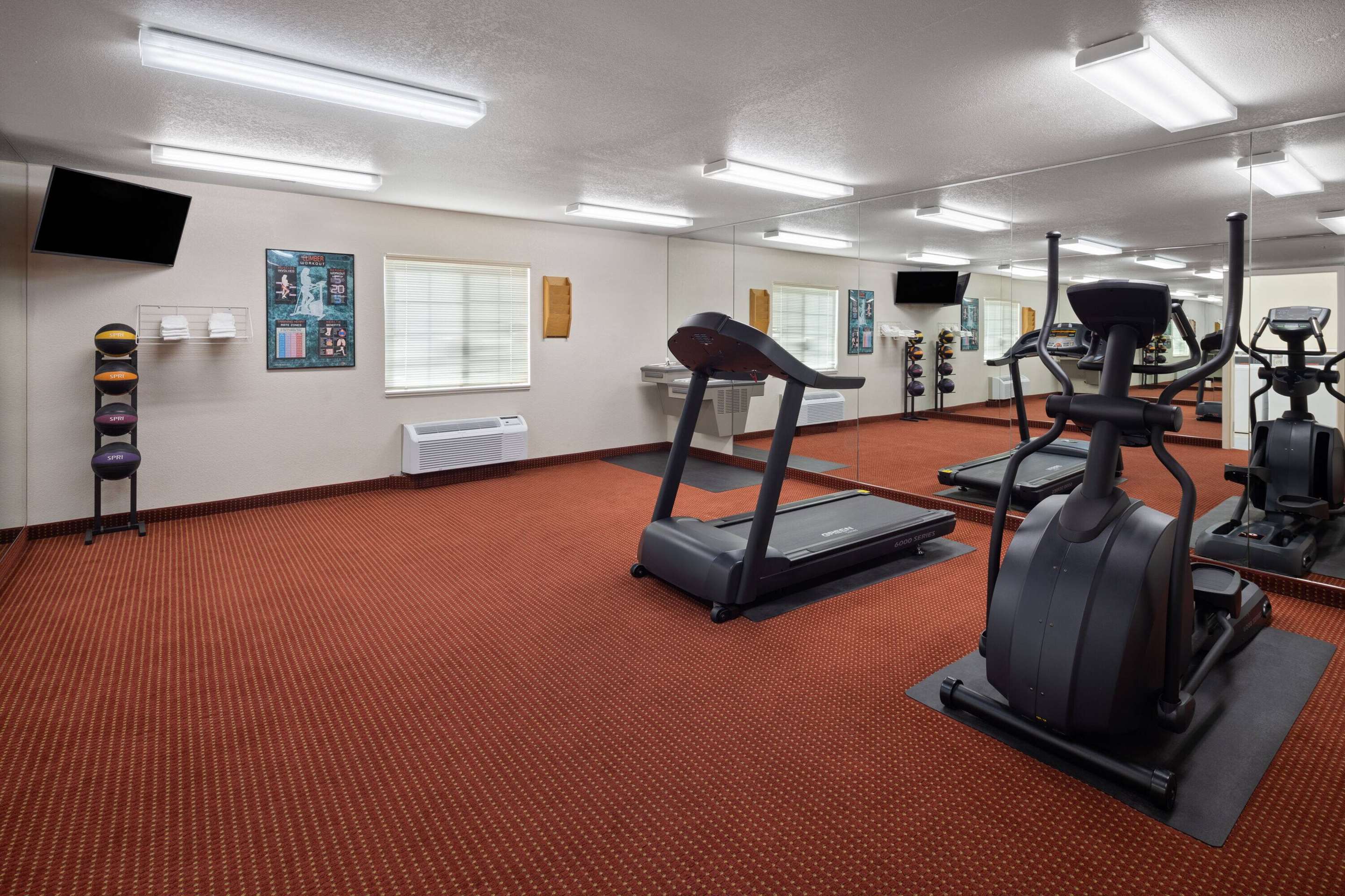 Health club fitness center gym | Days Inn & Suites by Wyndham Green Bay WI.