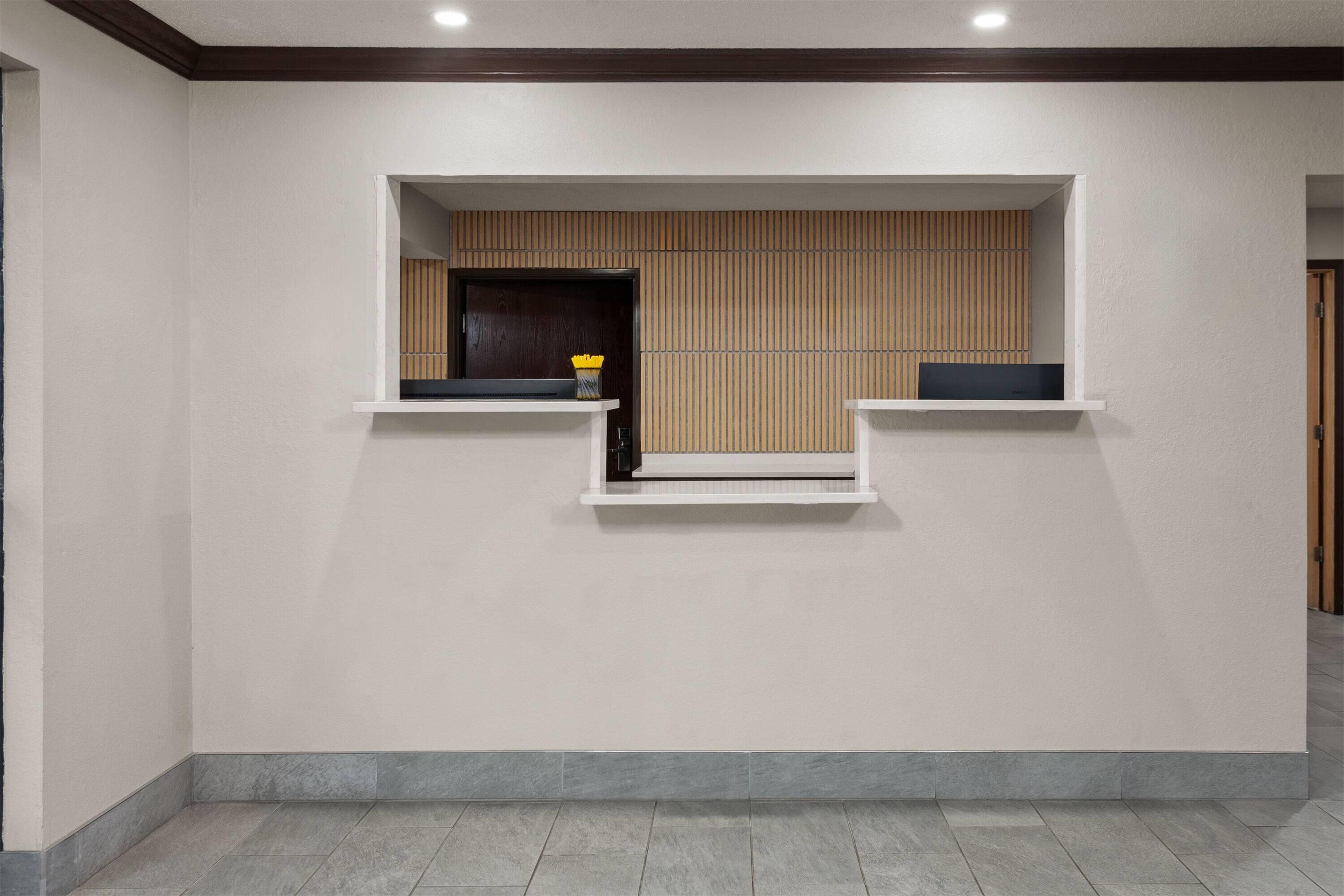 Reception | Days Inn & Suites by Wyndham Kaukauna WI