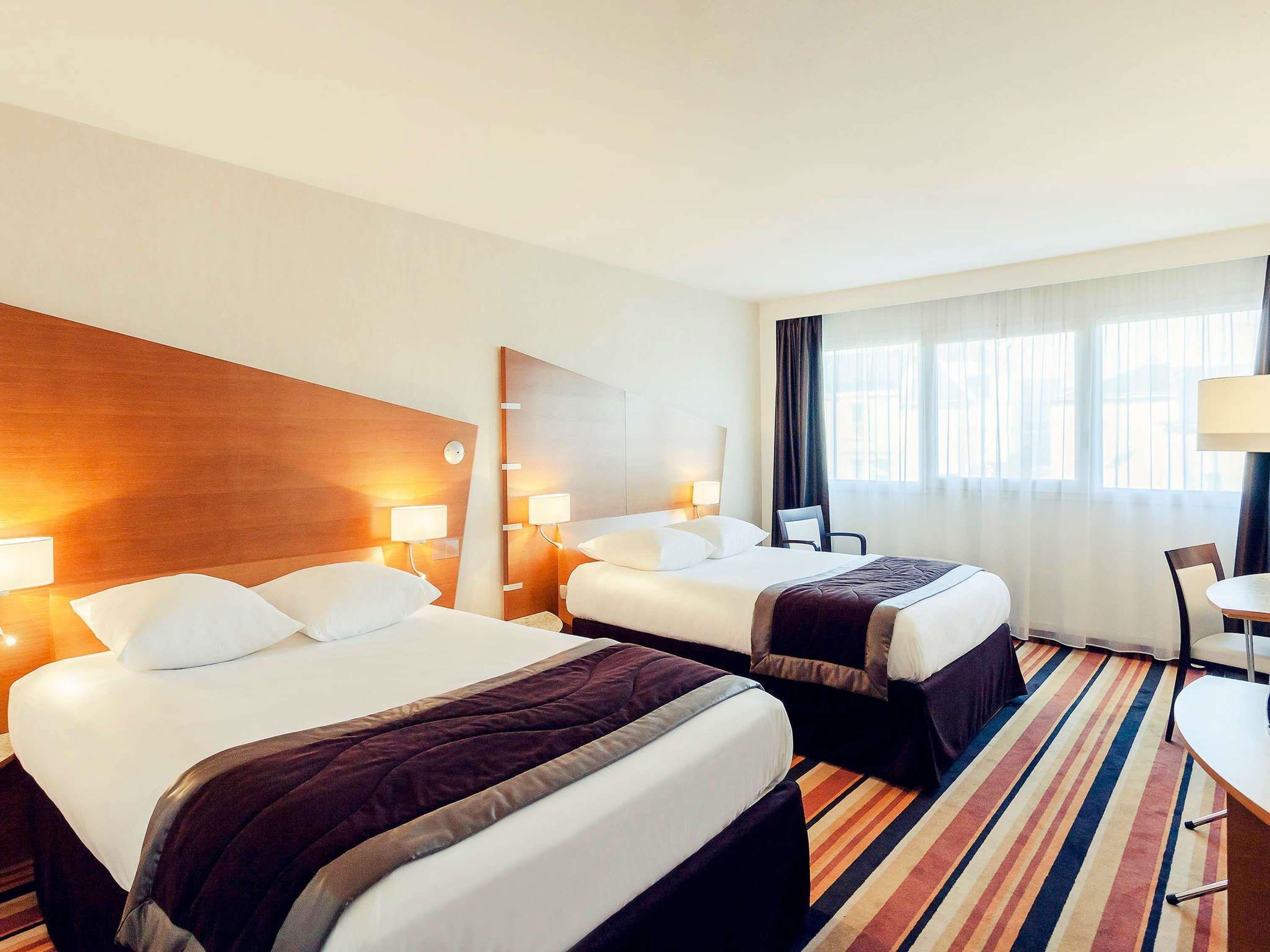 Mercure Orl Room Type - Superior room with large bed and sofa