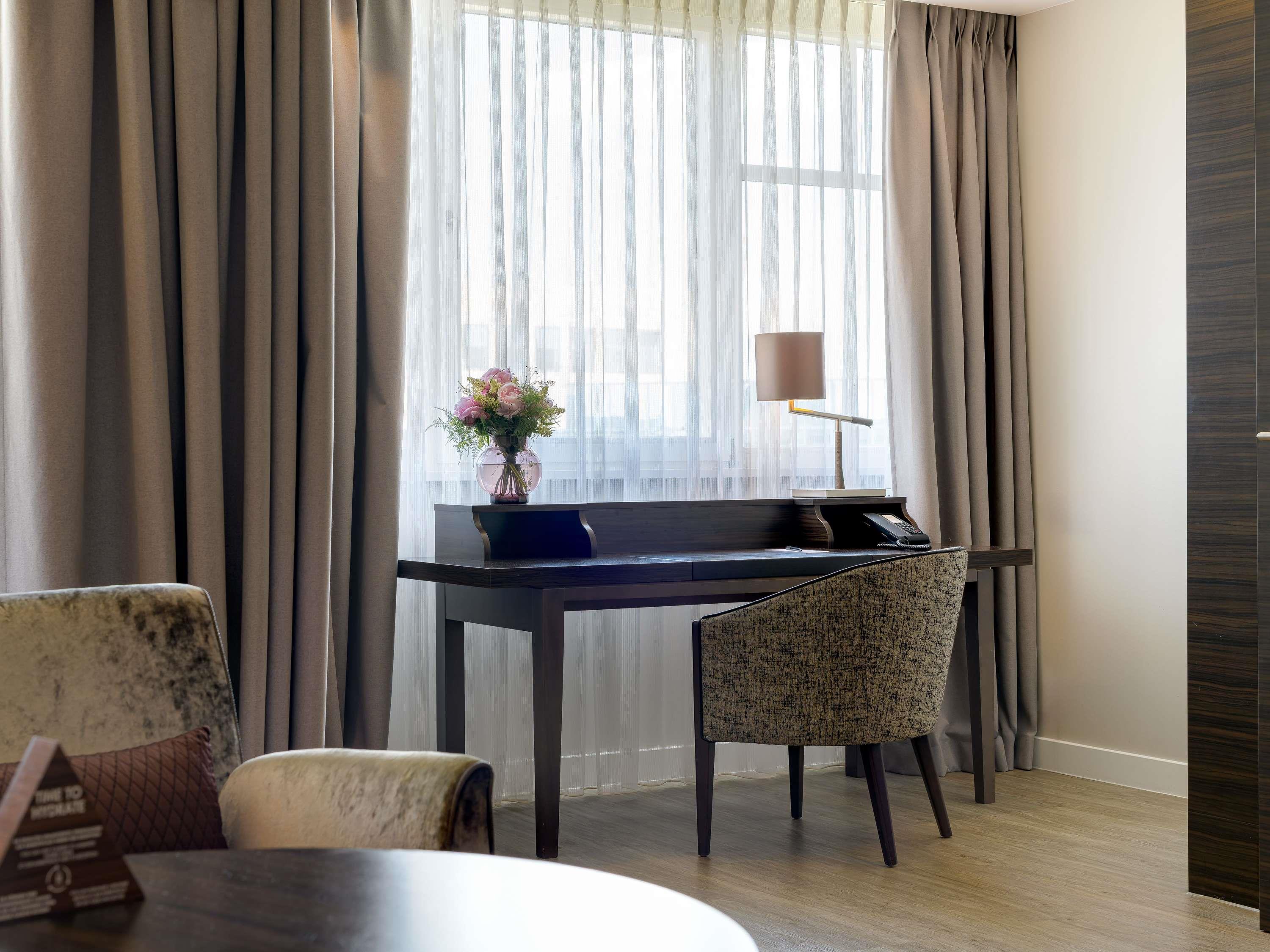 Pullman Munich Room Type - Superior Suite, living room and bedroom, largedouble bed, sofa bed, also ideal for families