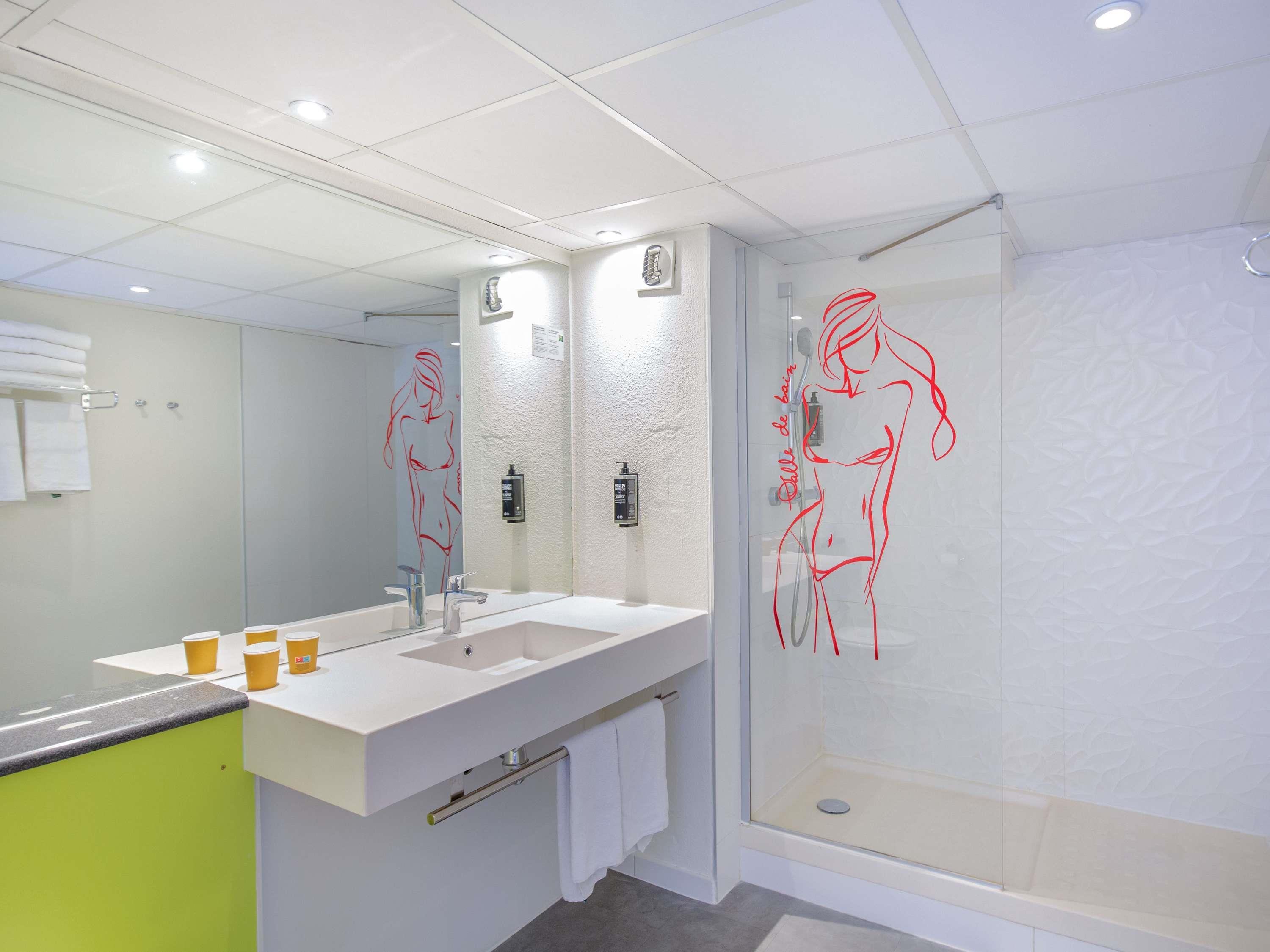 ibis Styles Cannes le Cannet Room Type - Standard bedroom suite with a large bed and a sofa bed