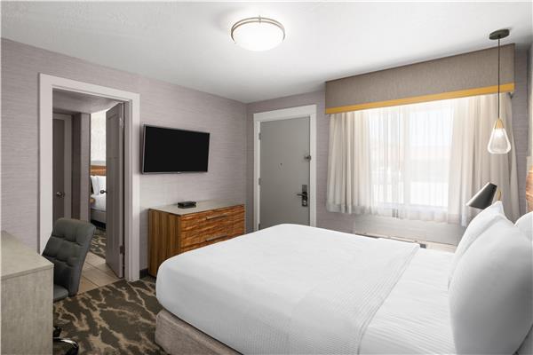 1 Queen 1 Double, Non-Smoking, Two Bedrooms, High Speed Internet Access, 50 Inch Flat Screen Television, Microwave And Refrigerator, Coffee Maker, Full Breakfast