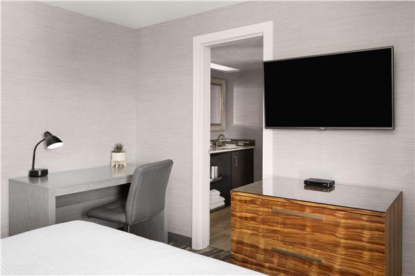 1 Queen 1 Double, Non-Smoking, Two Bedrooms, High Speed Internet Access, 50 Inch Flat Screen Television, Microwave And Refrigerator, Coffee Maker, Full Breakfast