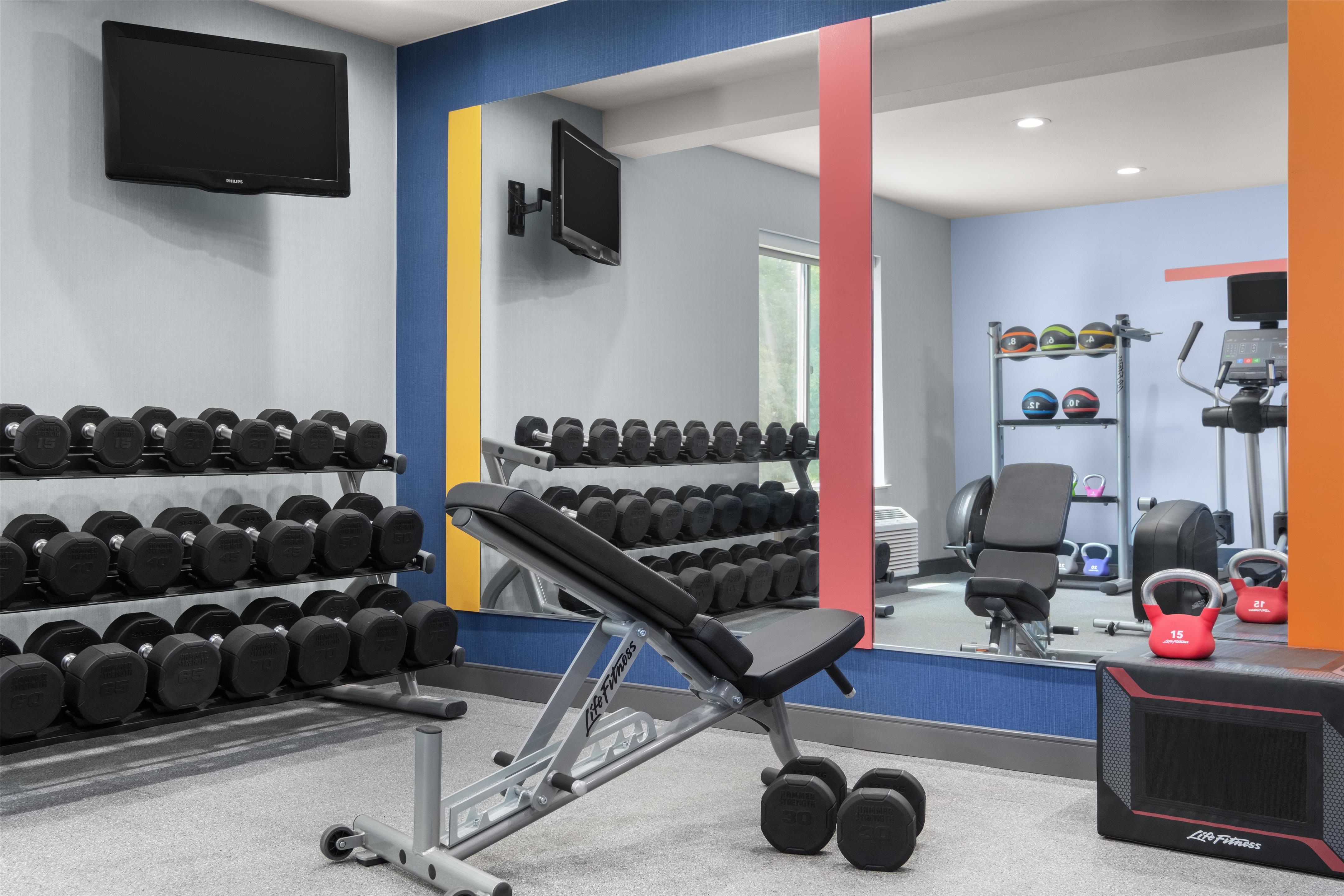 Health club fitness center gym | Hampton Inn & Suites Fresno