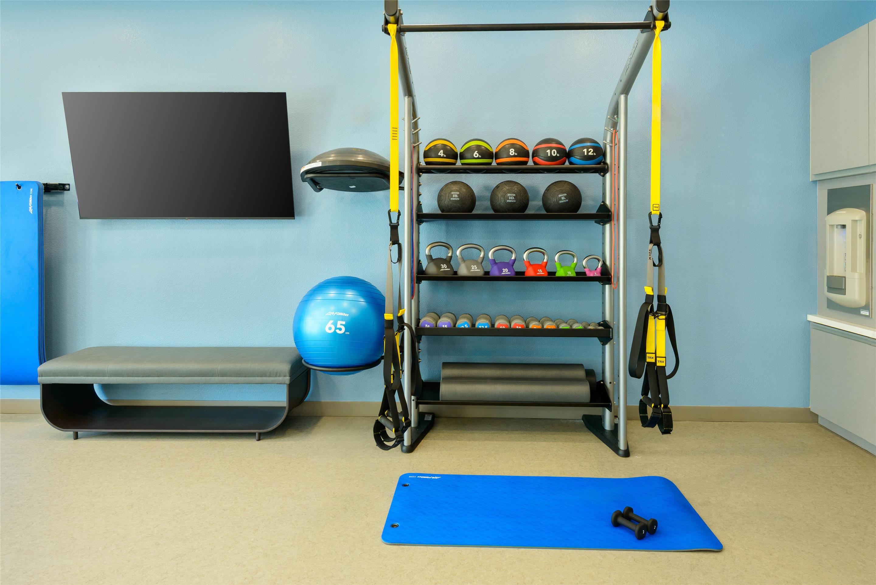 Health club fitness center gym | Homewood Suites by Hilton® Orlando-UCF Area