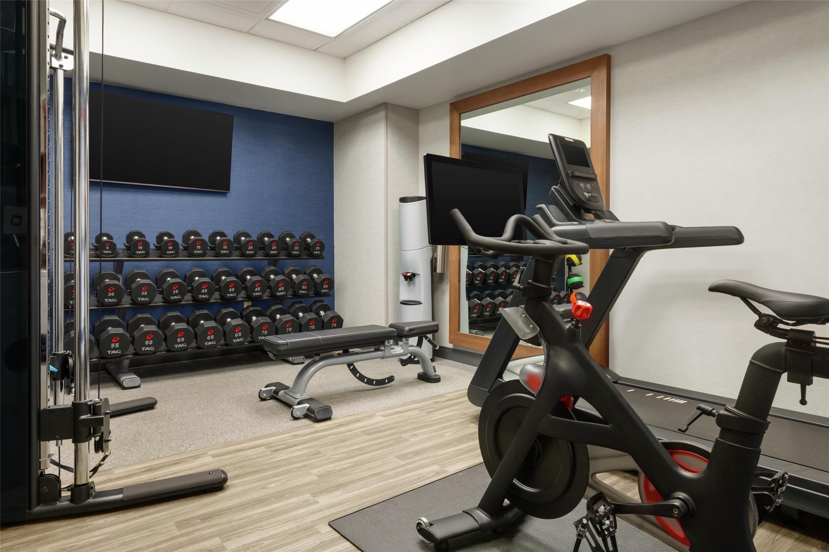Health club fitness center gym | Hampton Inn & Suites Greenville-Downtown-RiverPlace