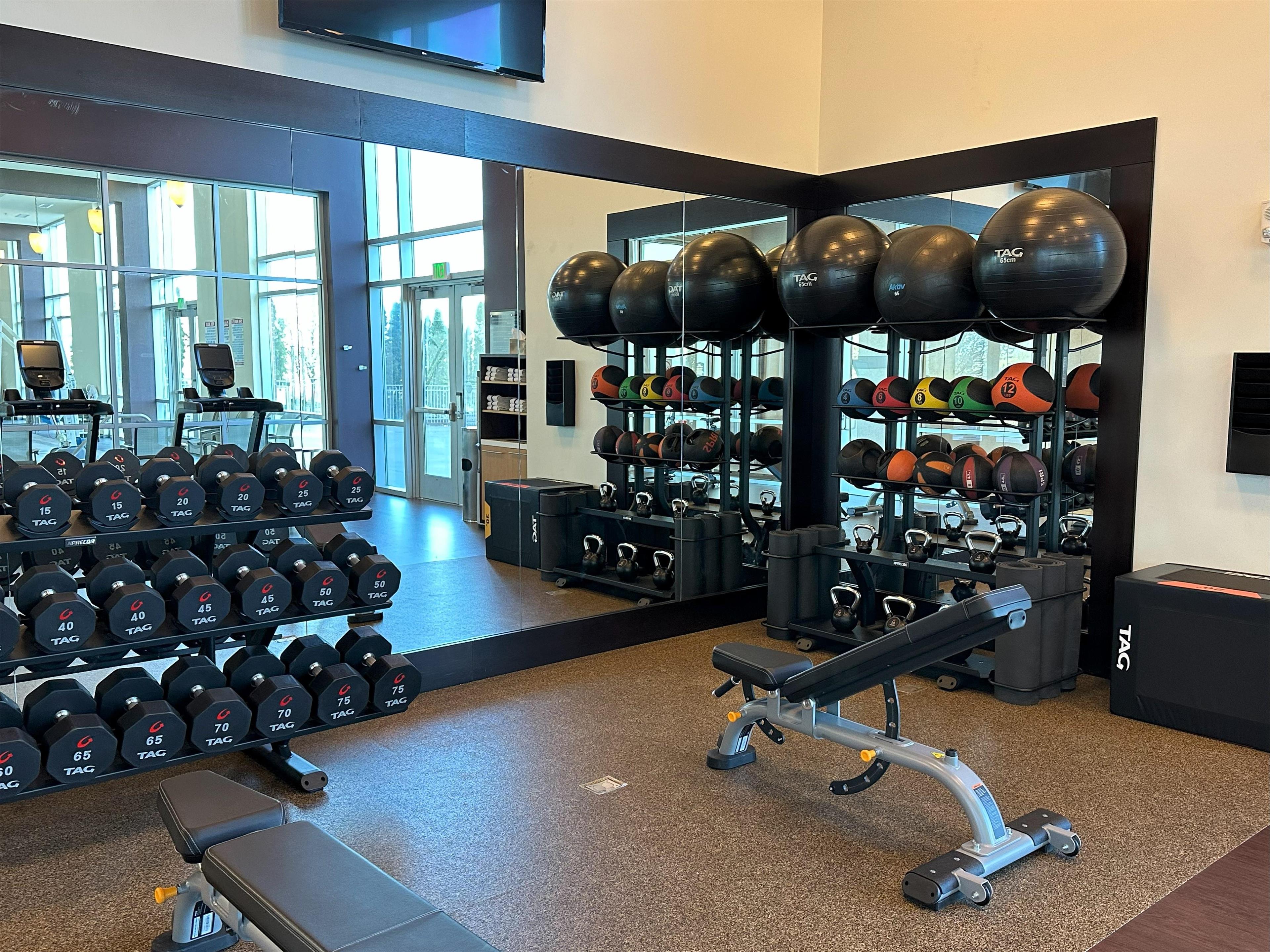 Health club fitness center gym | DoubleTree by Hilton Bay City - Riverfront