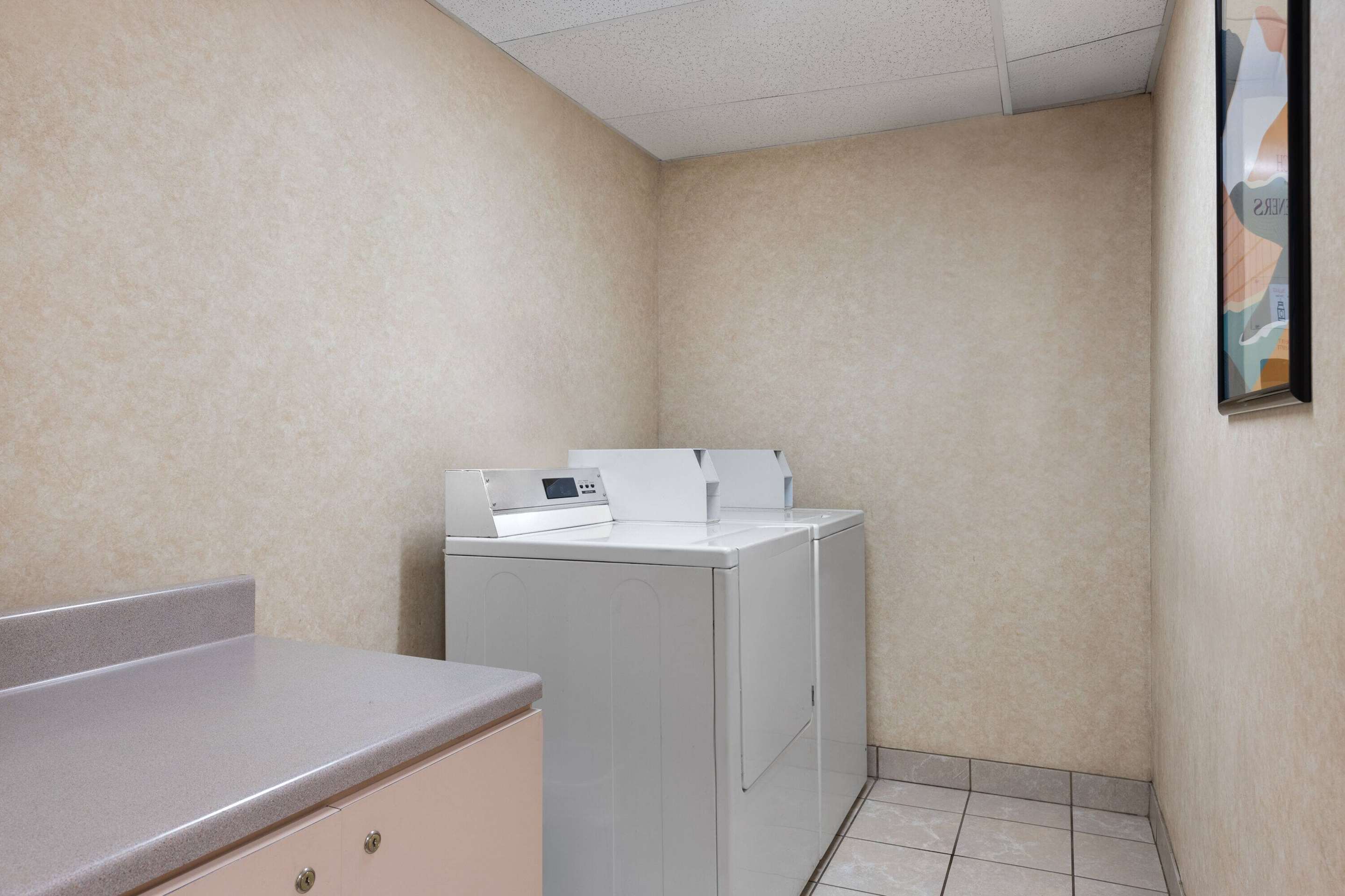 Laundry | Days Inn & Suites by Wyndham Kansas City South