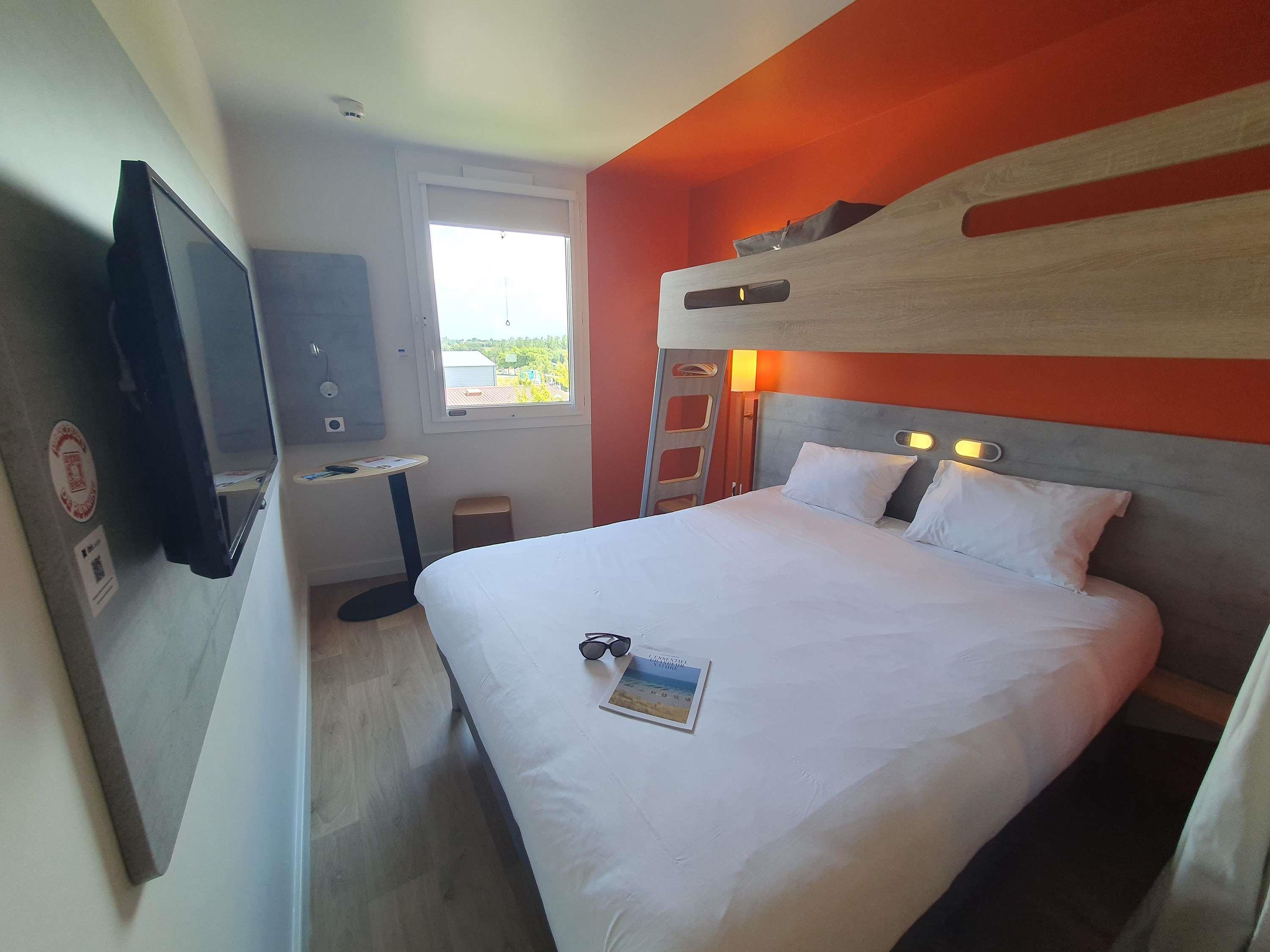 Ibis Budget Coutances Room Type - TRIPLE - room with a double bed and bunk bed