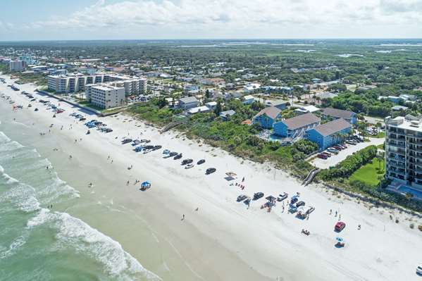 Beach - New Smyrna Waves Resort by Exploria