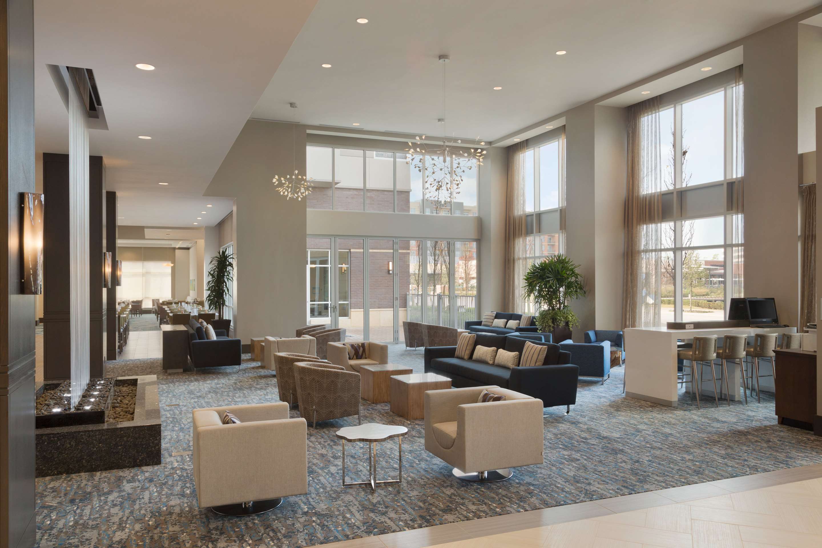 Reception | Embassy Suites by Hilton The Woodlands at Hughes Landing