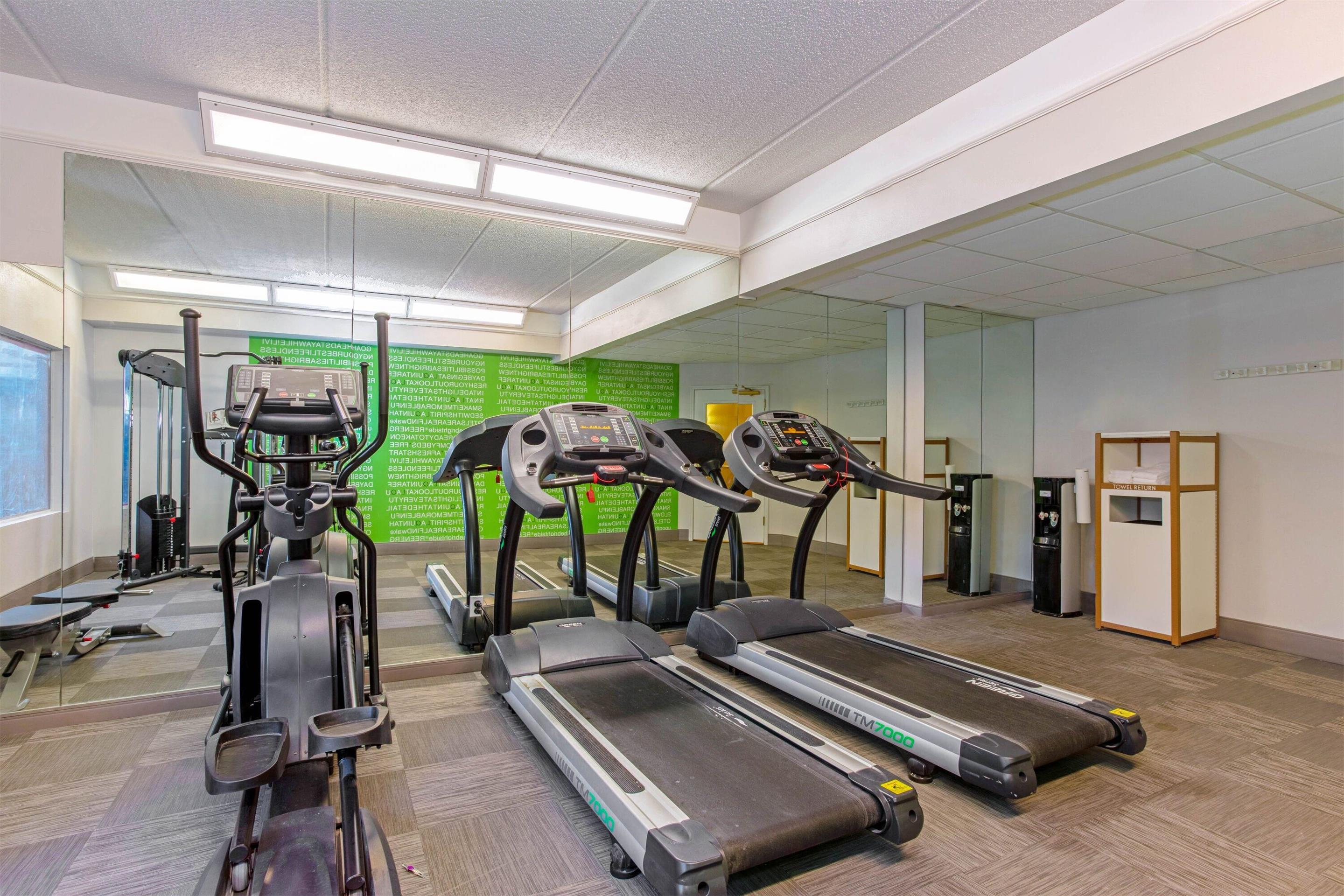 Health club fitness center gym | La Quinta Inn & Suites by Wyndham Orlando I Drive/Conv Ctr