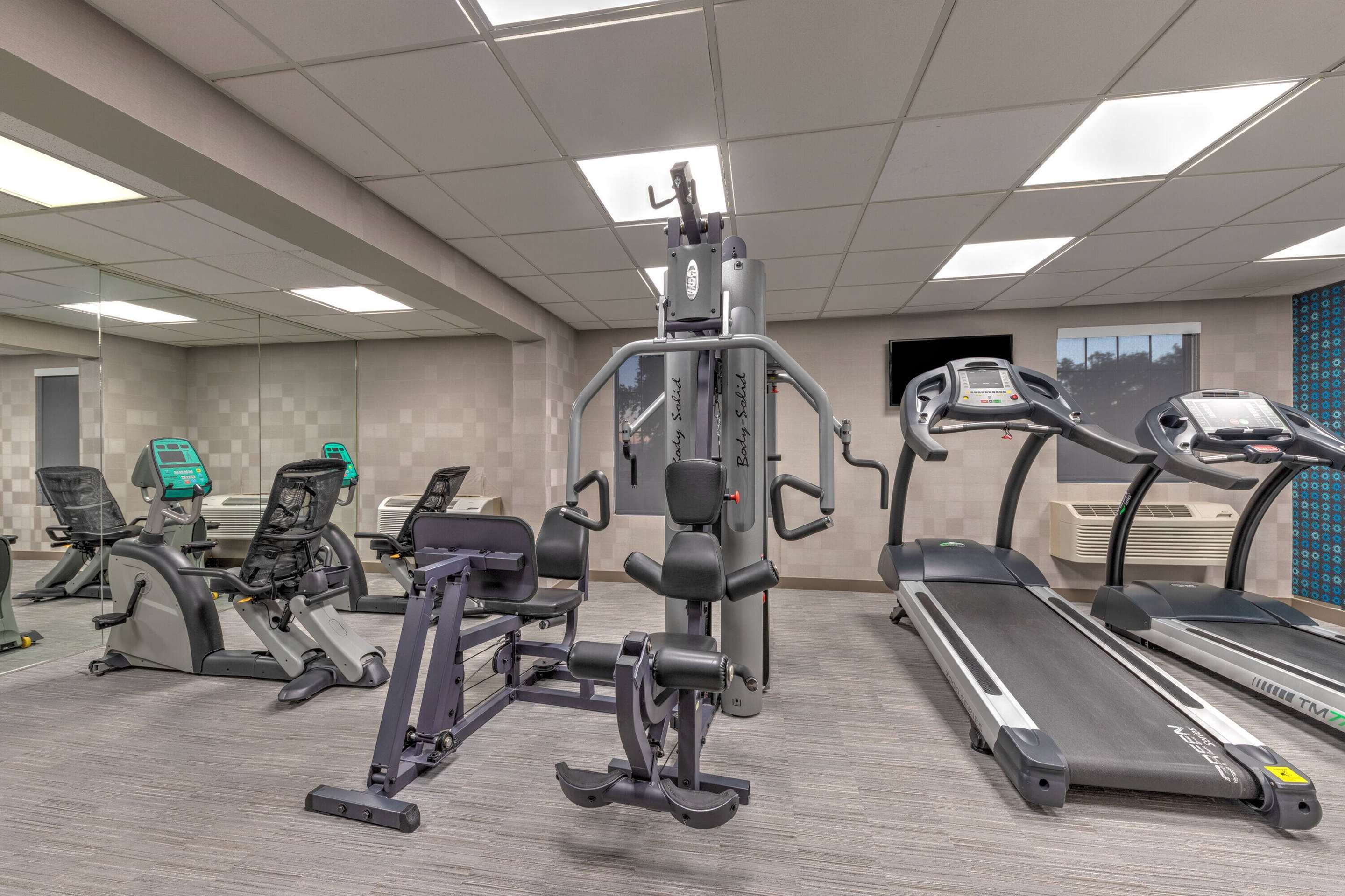 Health club fitness center gym | La Quinta Inn & Suites by Wyndham Dallas DFW Airport North