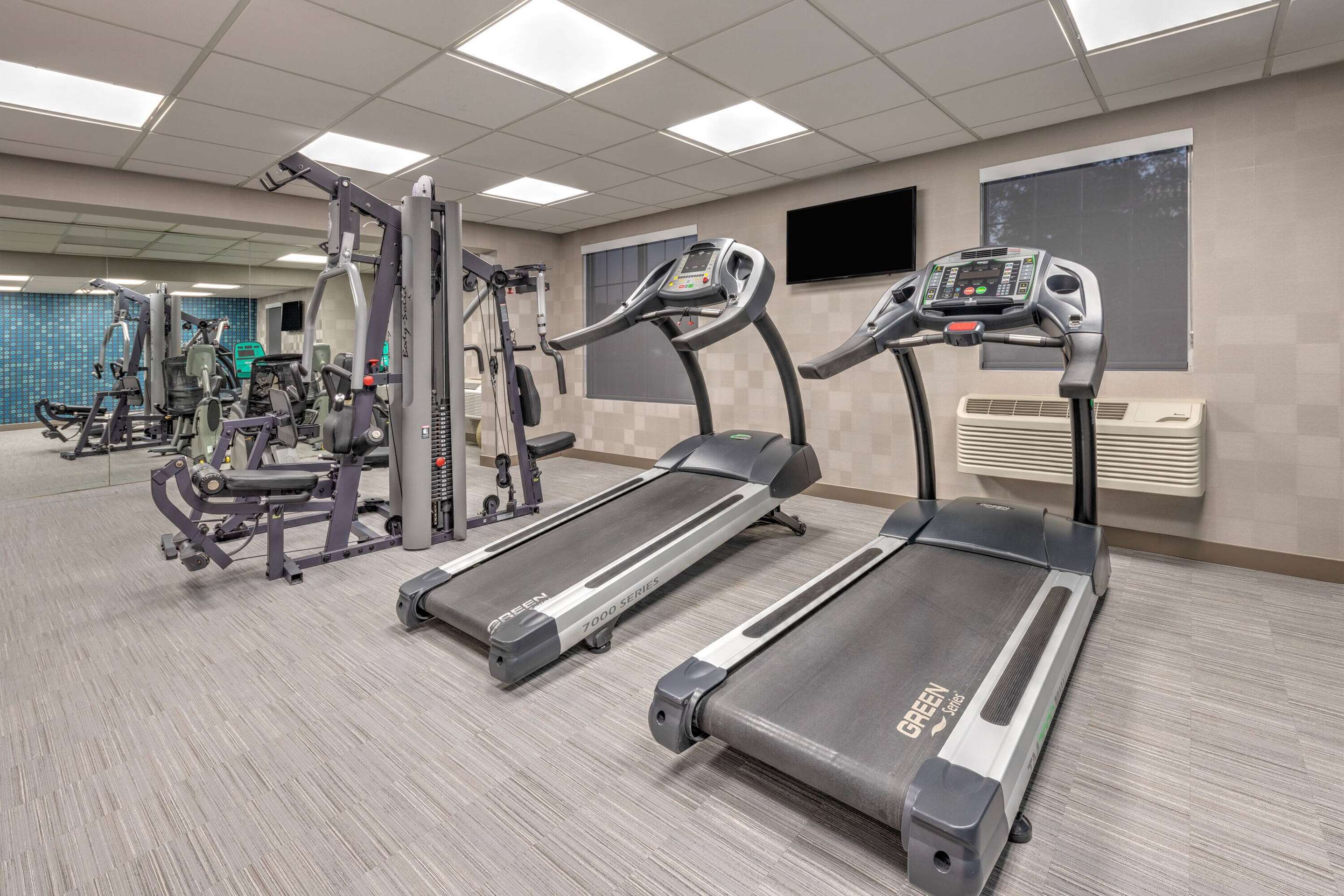 Health club fitness center gym | La Quinta Inn & Suites by Wyndham Dallas DFW Airport North