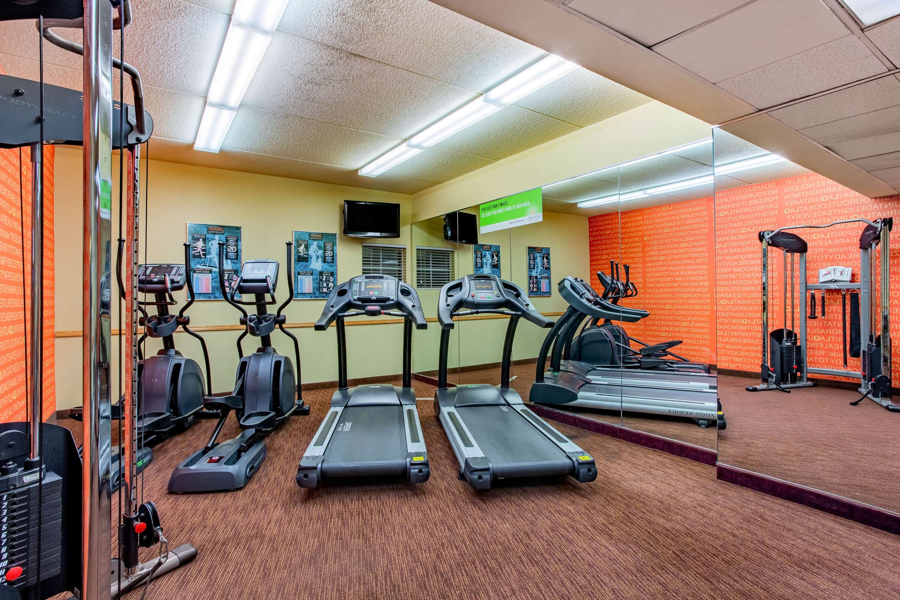 Health club fitness center gym | La Quinta Inn & Suites by Wyndham Raleigh Crabtree