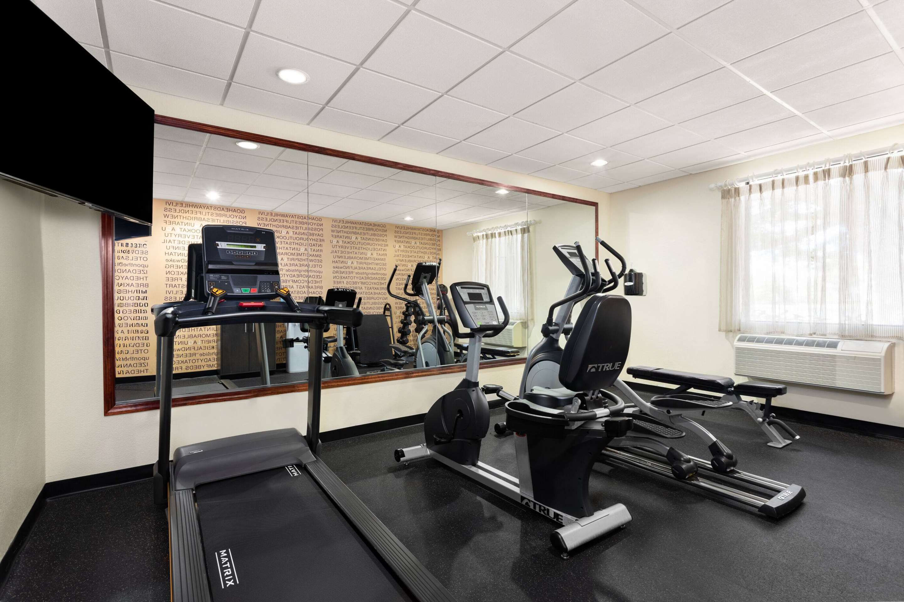 Health club fitness center gym | La Quinta Inn & Suites by Wyndham Bonita Springs Naples N.