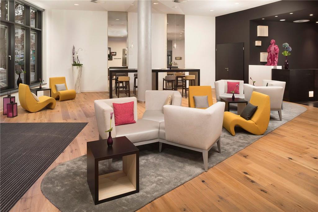 INNSIDE FRANKFURT OSTEND-guestroom-Guest Room,Living Area,Architecture,Indoor/Interior,On-Site,People,Décor detail,View from room,Exterior View of Building.jpg