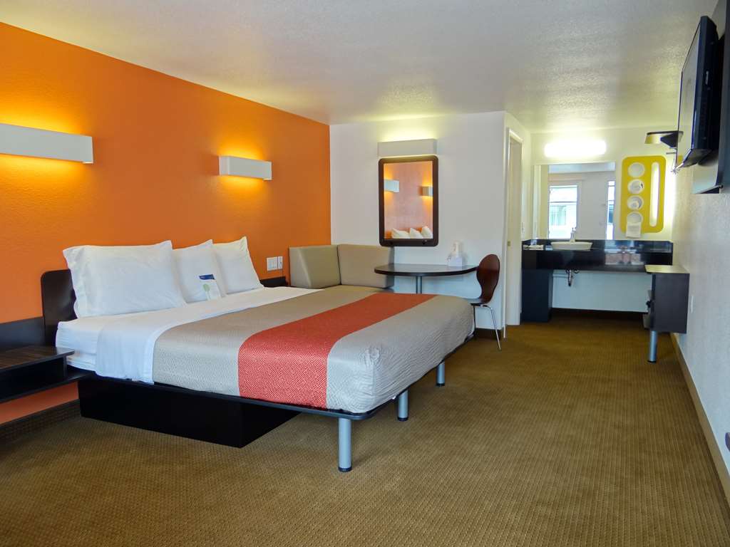 MOTEL 6 ERIE-guestroom-Guest Room,Bathroom,Sink,Bed,Bedding,Guest Room Amenity,TV and multimedia,Sitting area,Indoor/Interior,On-Site,Furnishings.jpg
