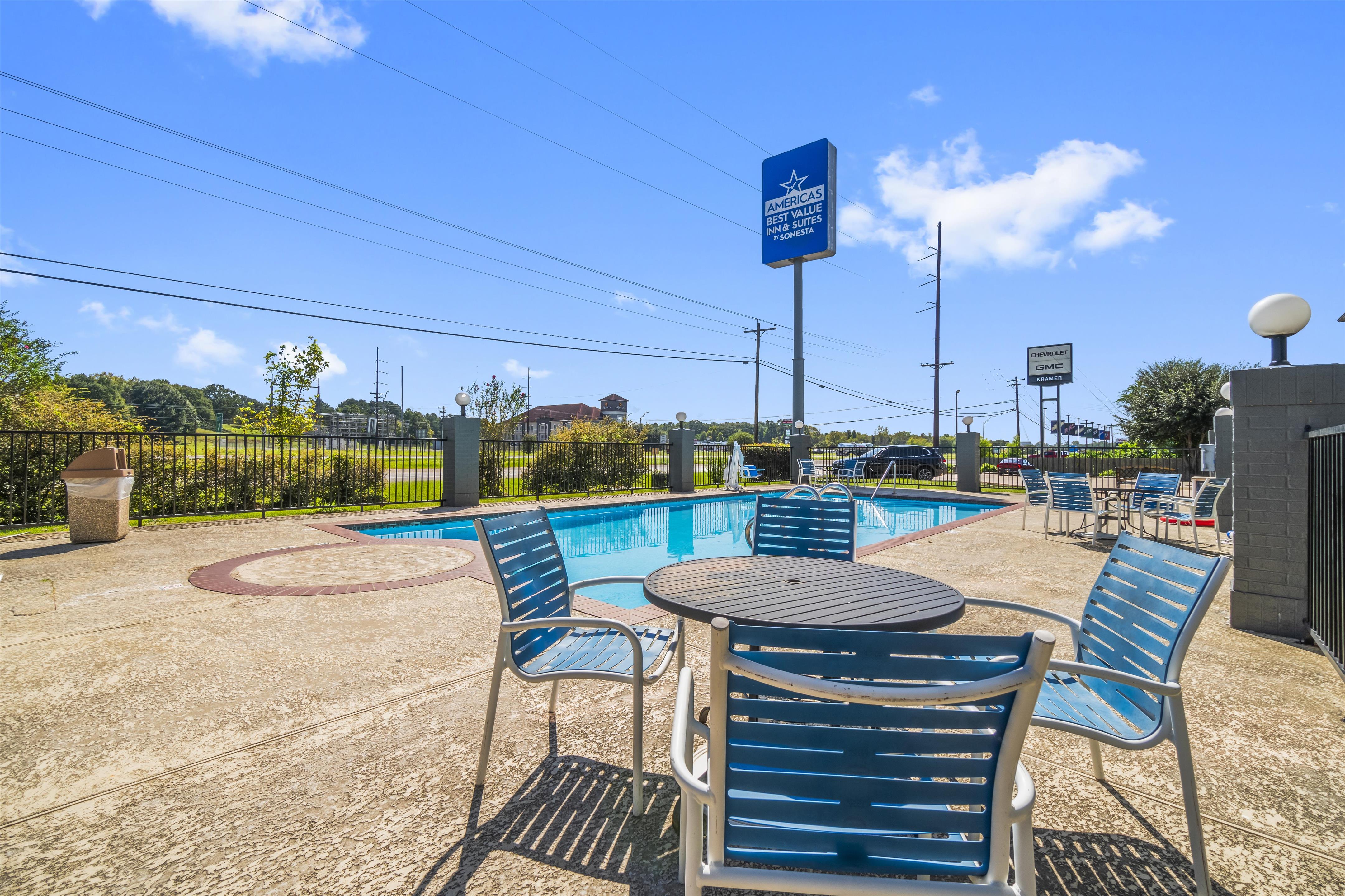 Outdoor Pool Table and Chairs | Americas Best Value Inn & Suites Livingston