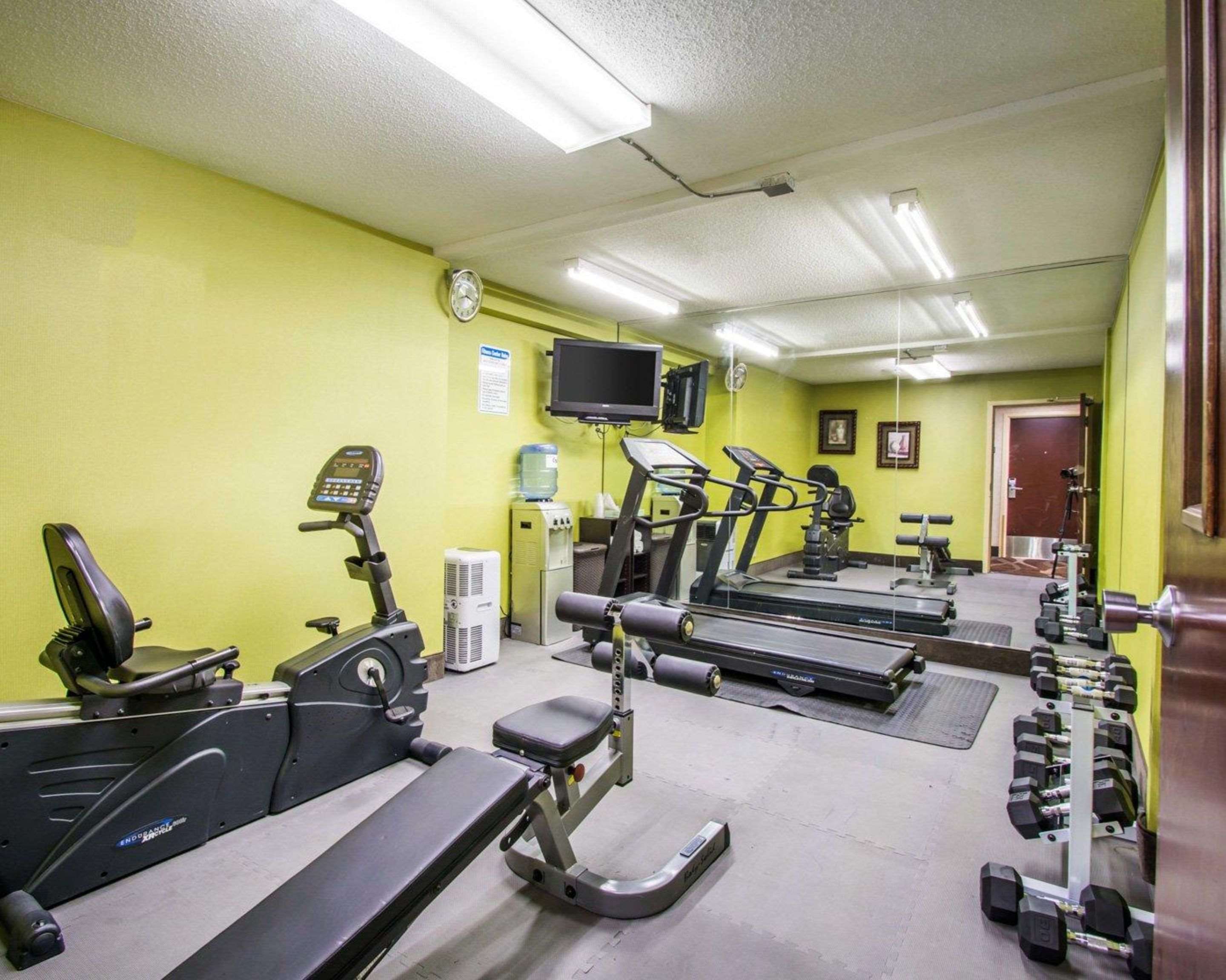 Exercise room with cardio equipment and weights