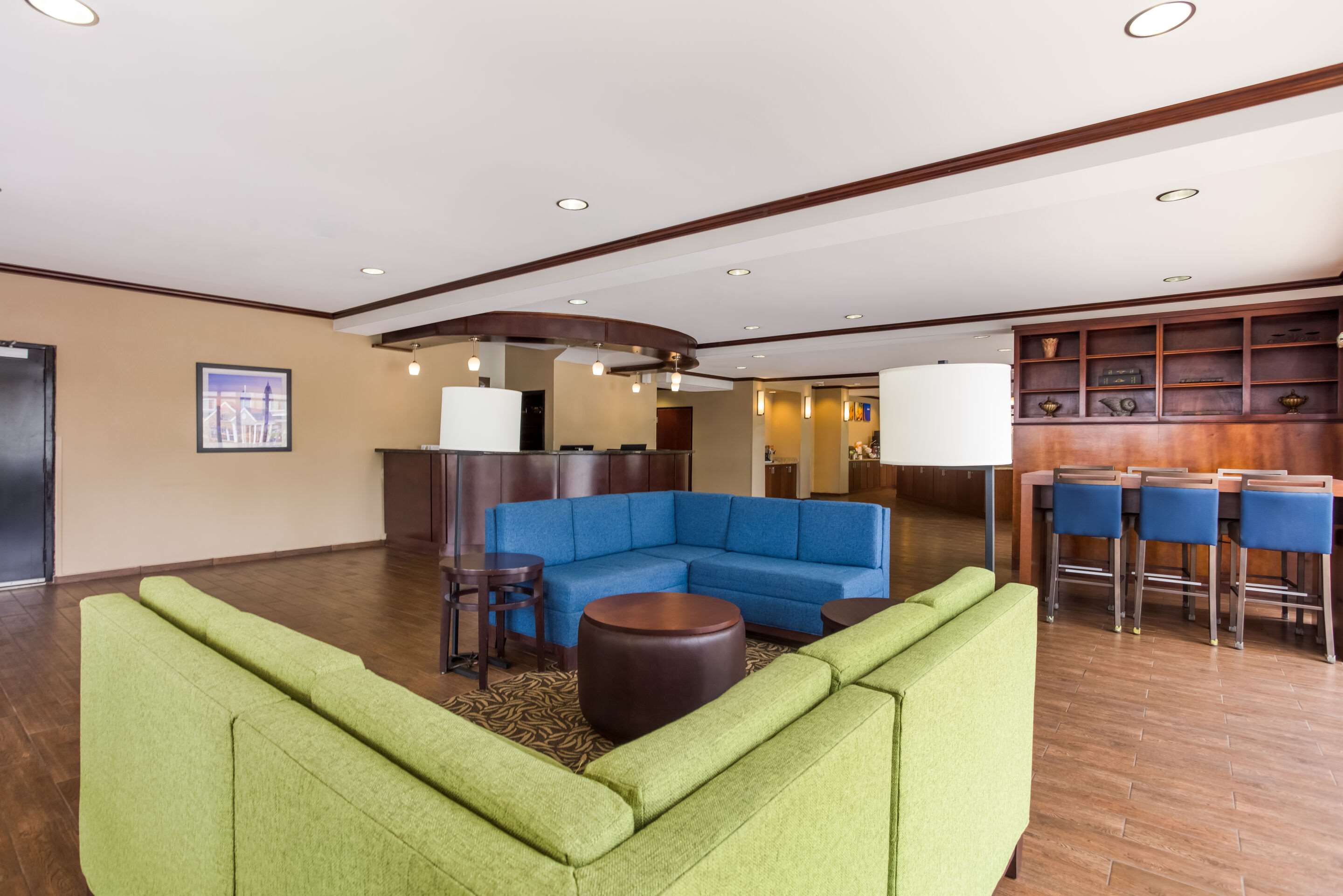 Spacious lobby with sitting area | Comfort Suites North Mobile