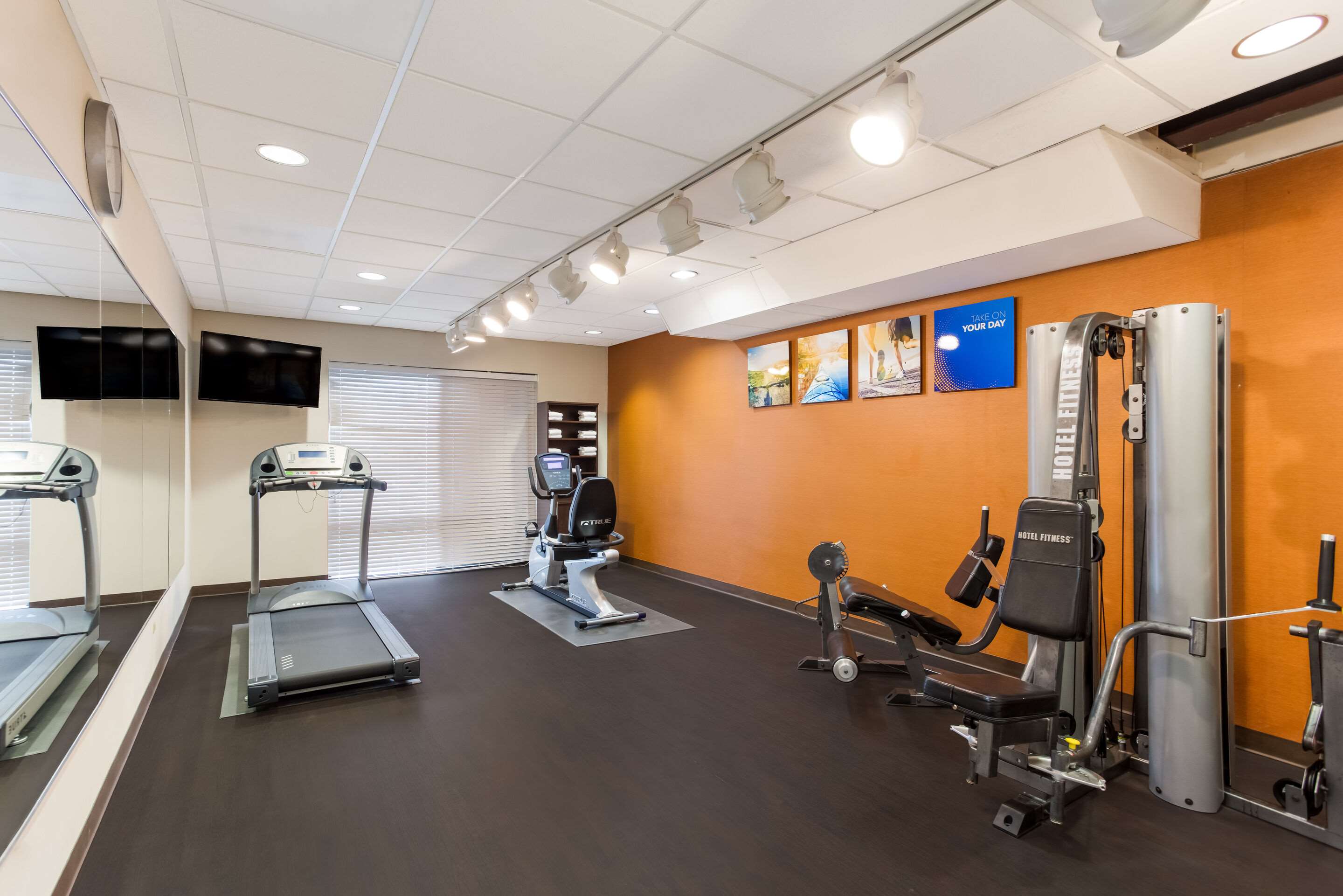 Exercise room with cardio equipment | Comfort Suites North Mobile