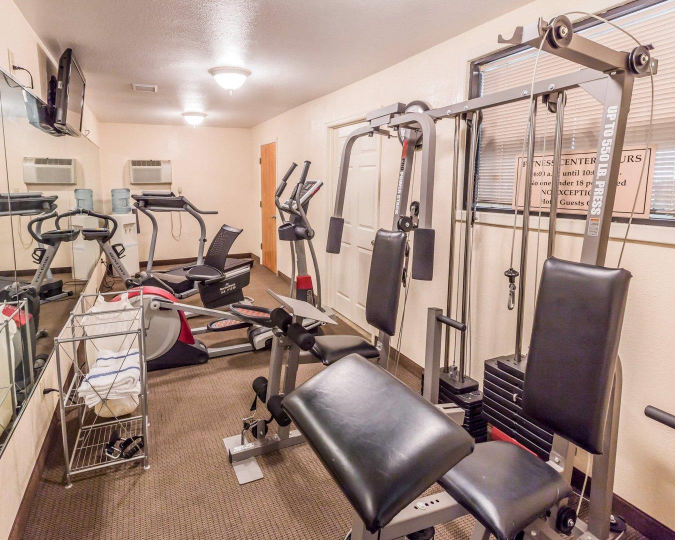 Exercise room with cardio equipment and weights | Quality Inn Pell City I-20 exit 158