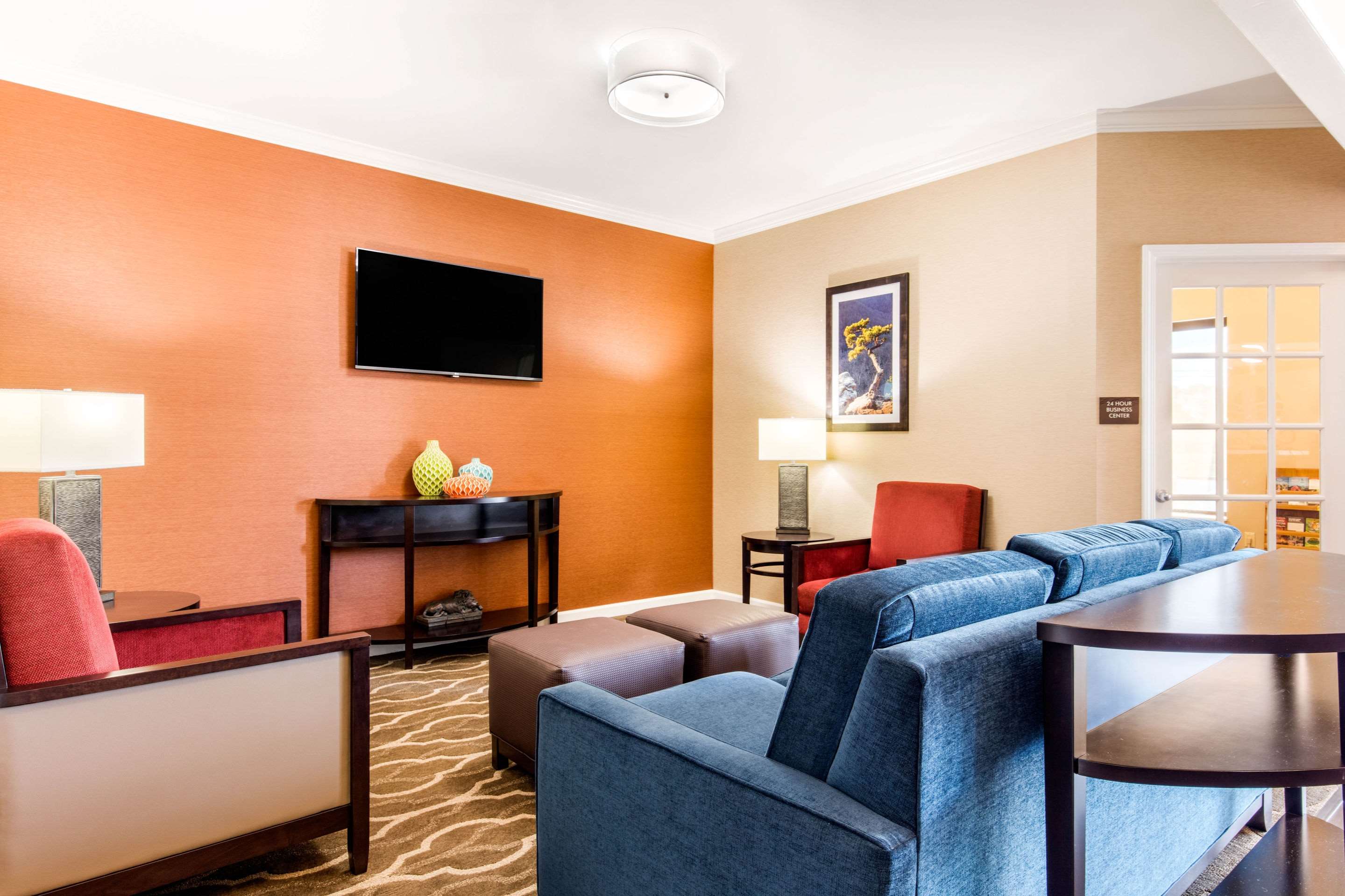 Spacious lobby with sitting area | Comfort Inn & Suites Bryant - Benton
