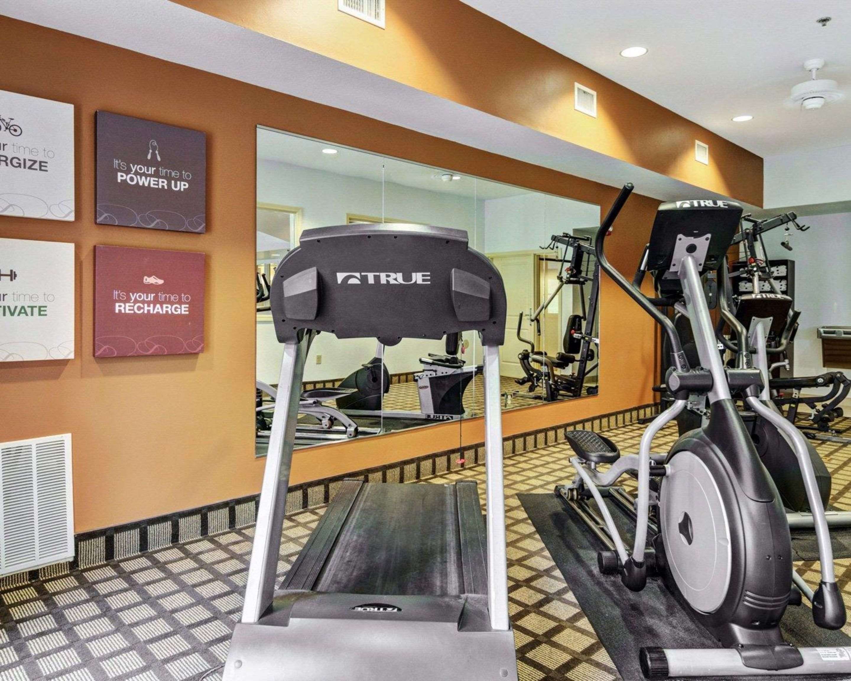 Exercise room with cardio equipment and weights