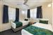 Guest room with one queen bed and two single beds