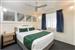 Guest room with one queen bed and two single beds