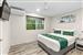 Guest room with one queen bed and two single beds
